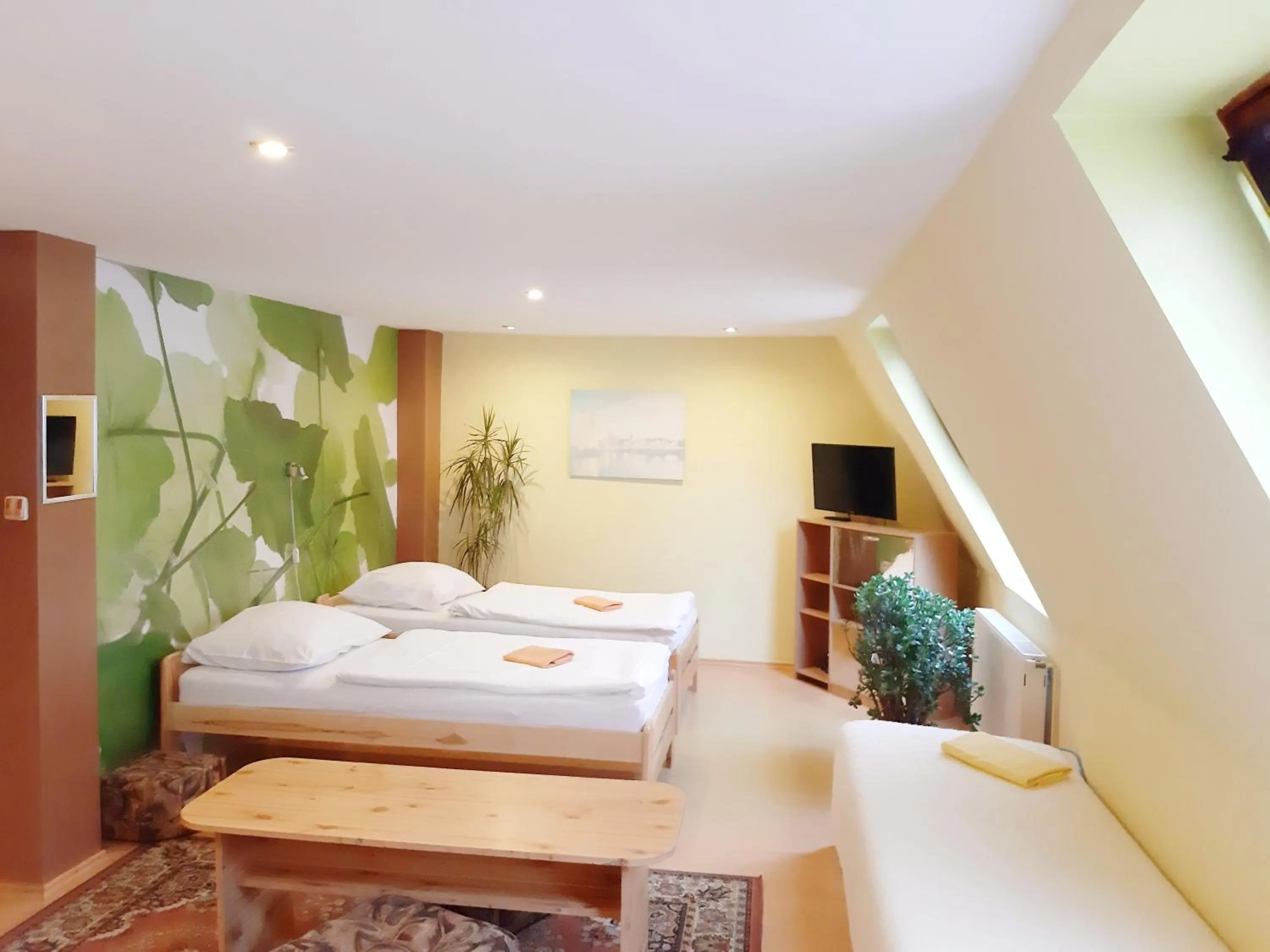 Quadruple Room with extra bed and Garden View in Penzion Havaj