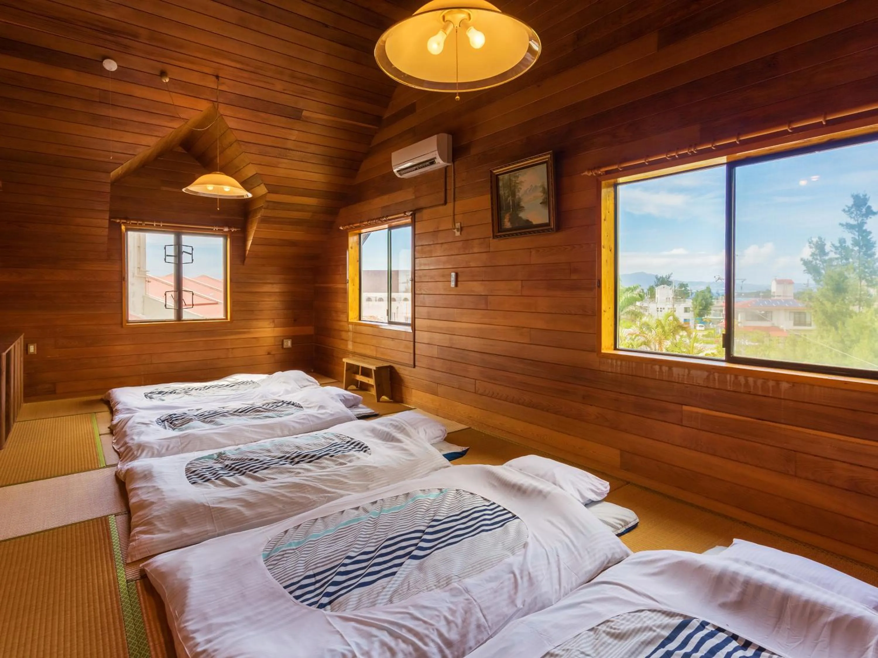 Living room, Bed in Kariyushi Condominium Resort Yuudekiya