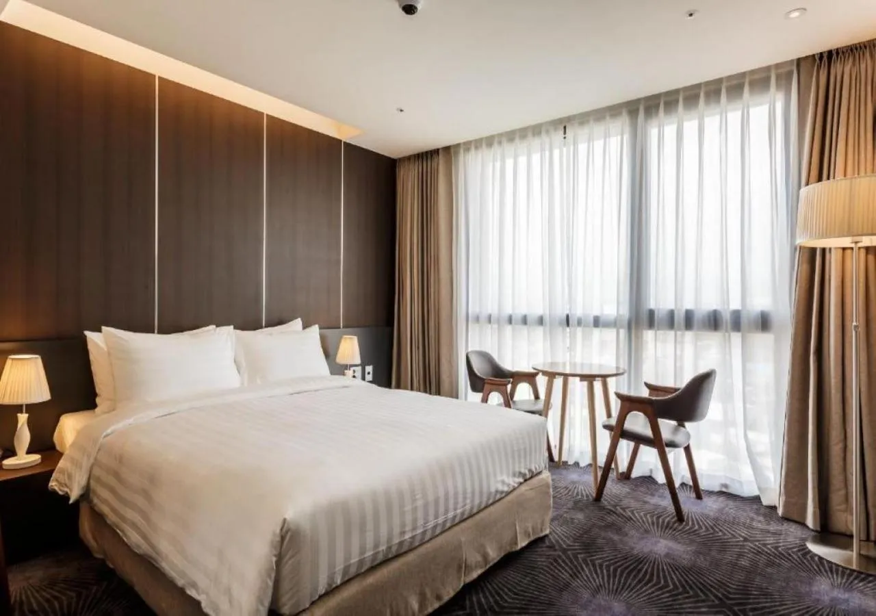 Bed in Golden Daisy Hotel