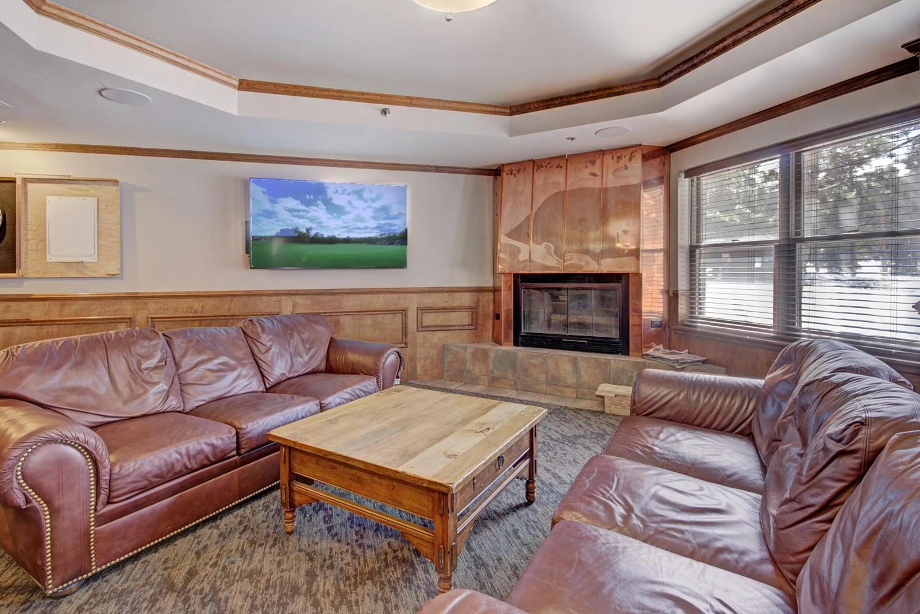 Communal lounge/ TV room in River Mountain Lodge by Breckenridge Hospitality
