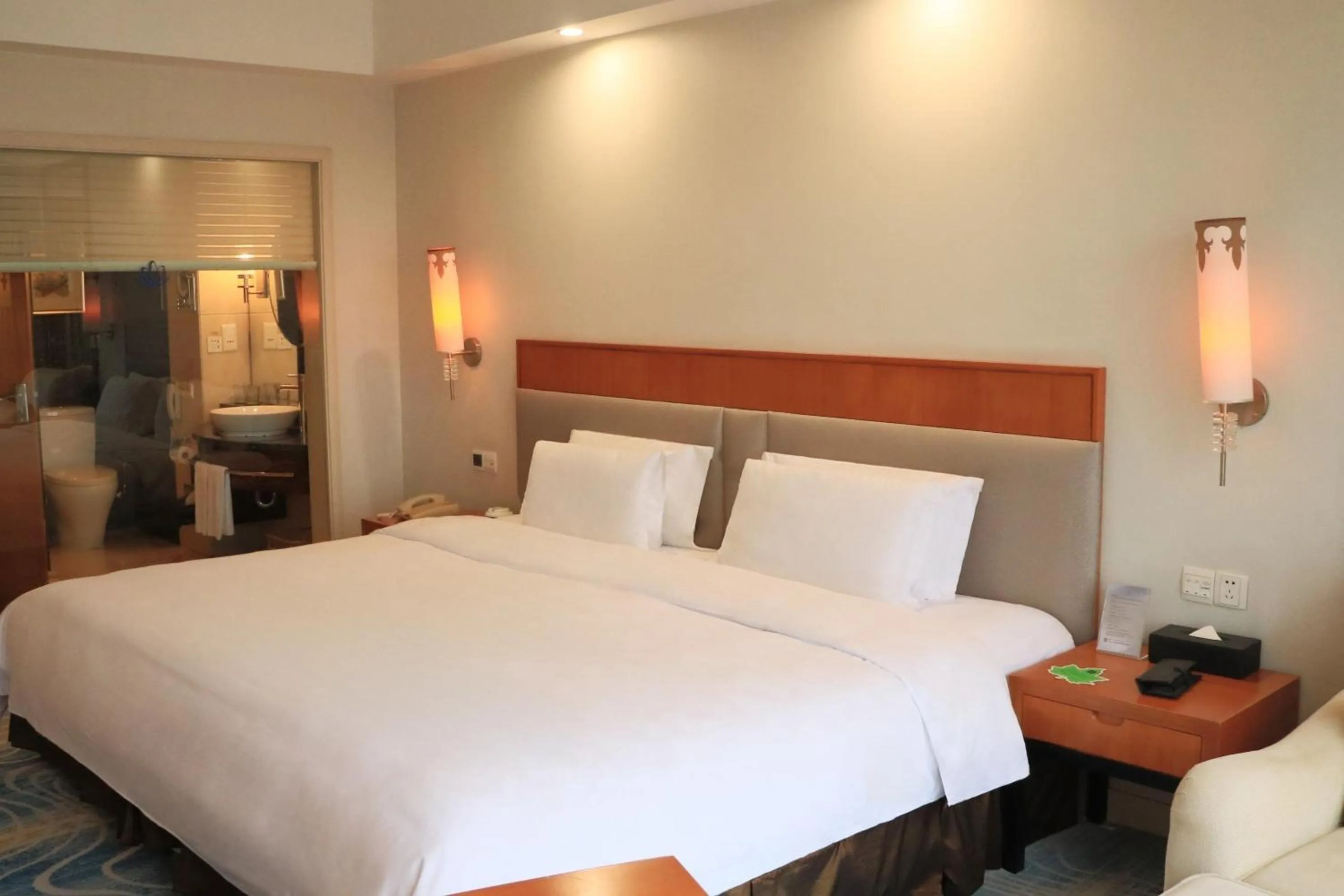 Bed in Dongguan Well Garden Hotel