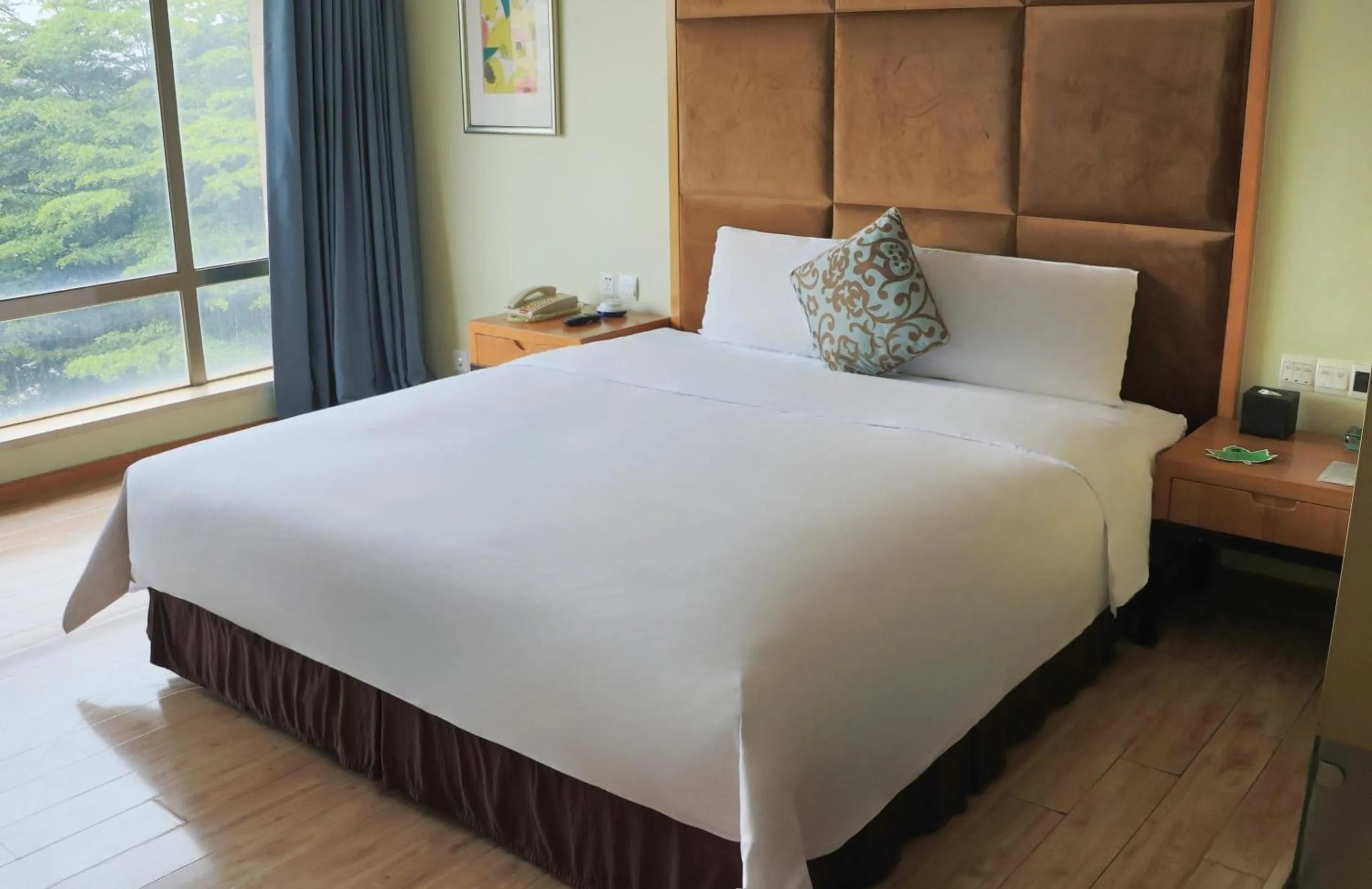 Bed in Dongguan Well Garden Hotel