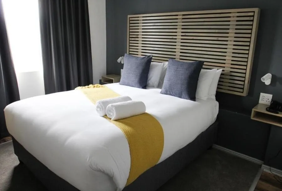 Bed in New National Hotel and Conference