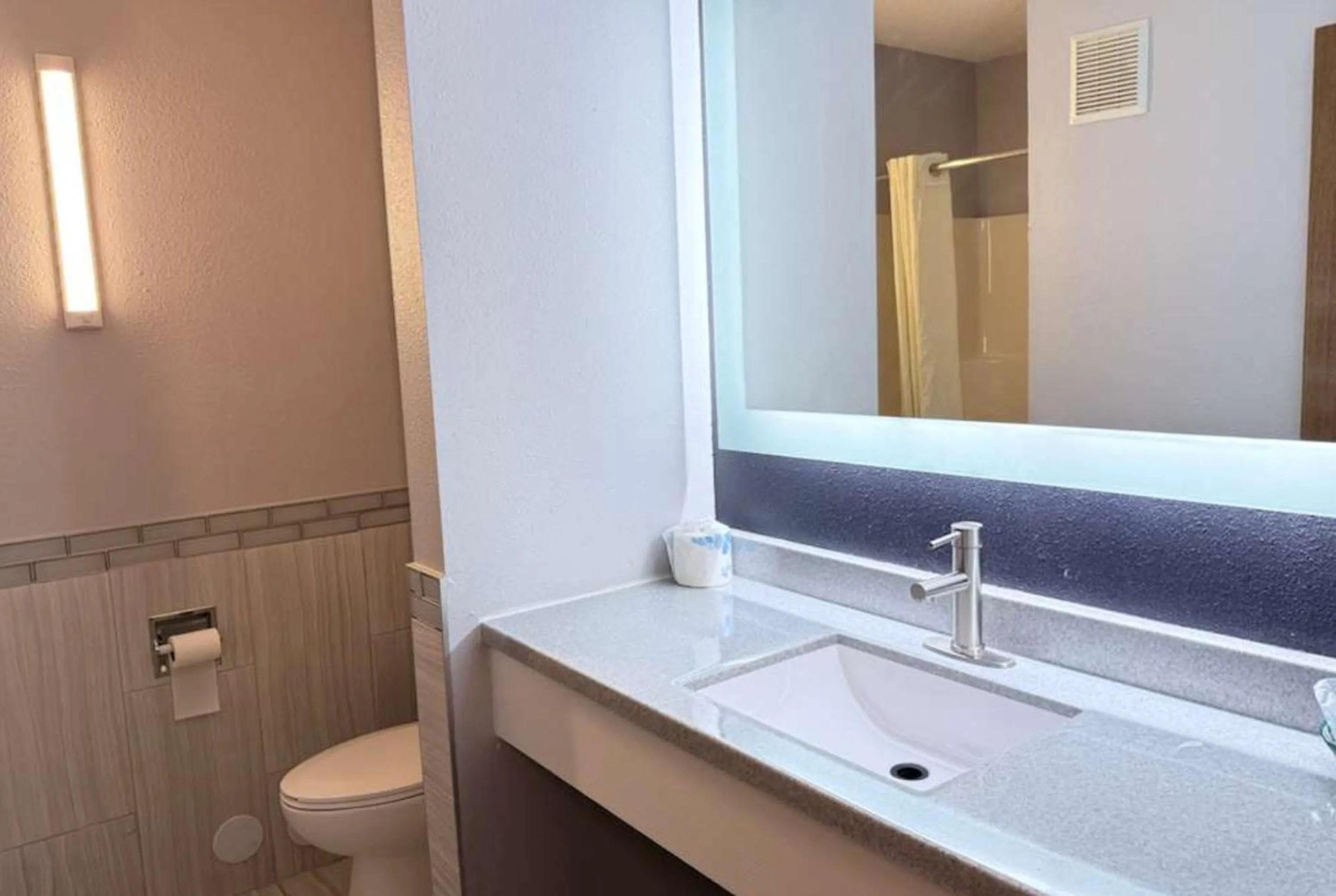 Bathroom in Coratel Inn & Suites by Jasper Hastings