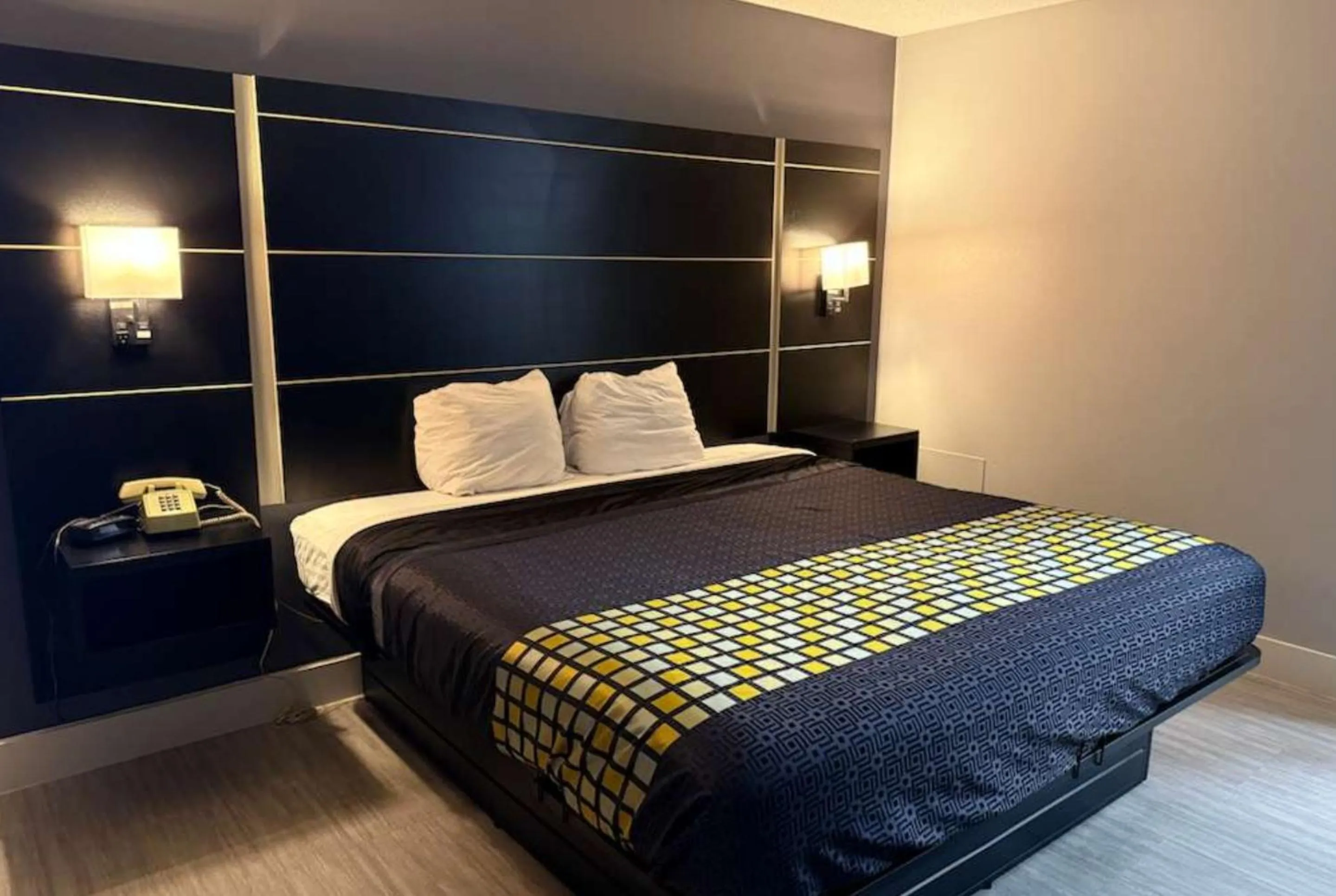 Bed in Coratel Inn & Suites by Jasper Hastings