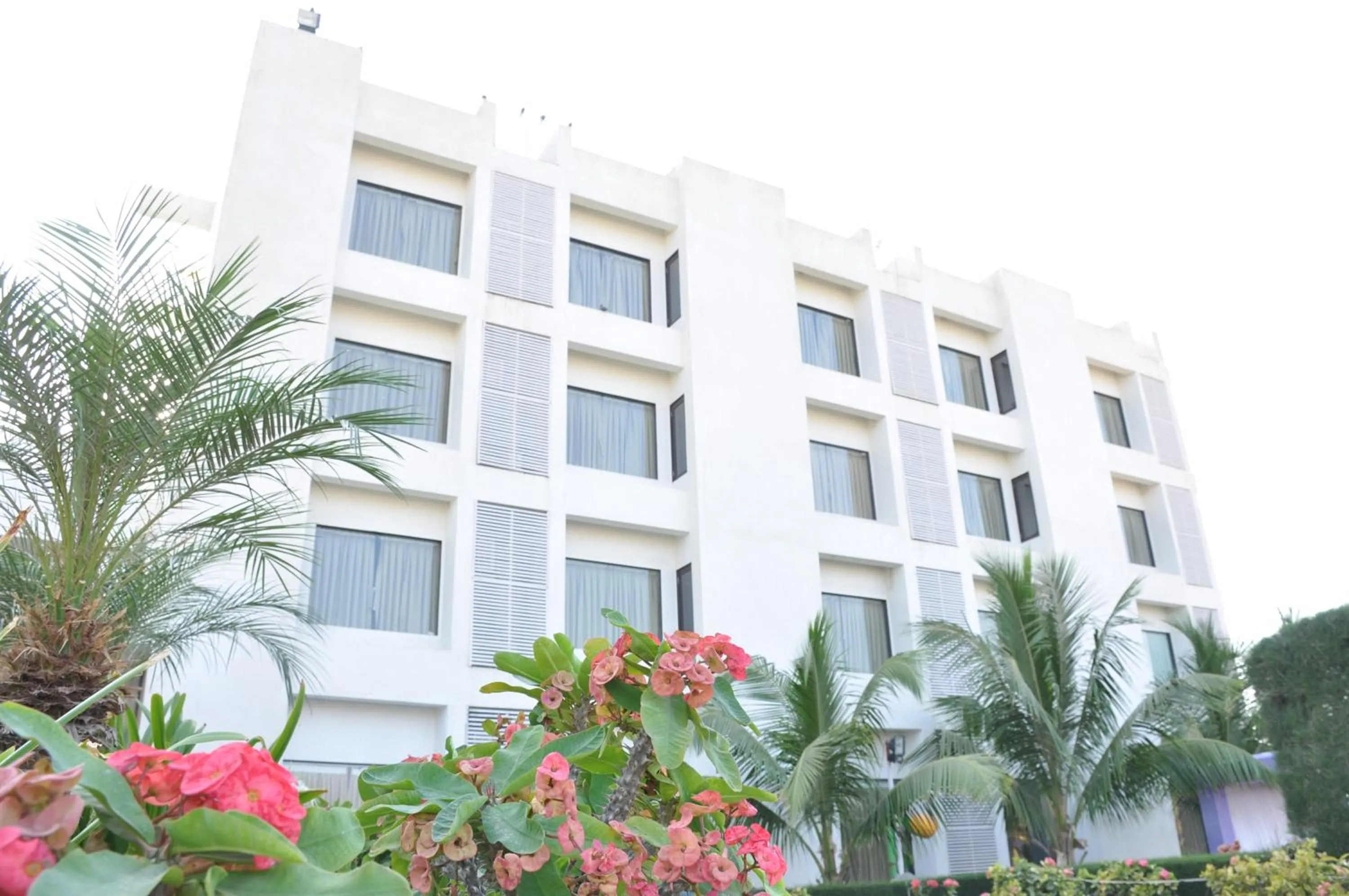 Property building in Goverdhan Greens Resort Dwarka l Hotels In Dwarka