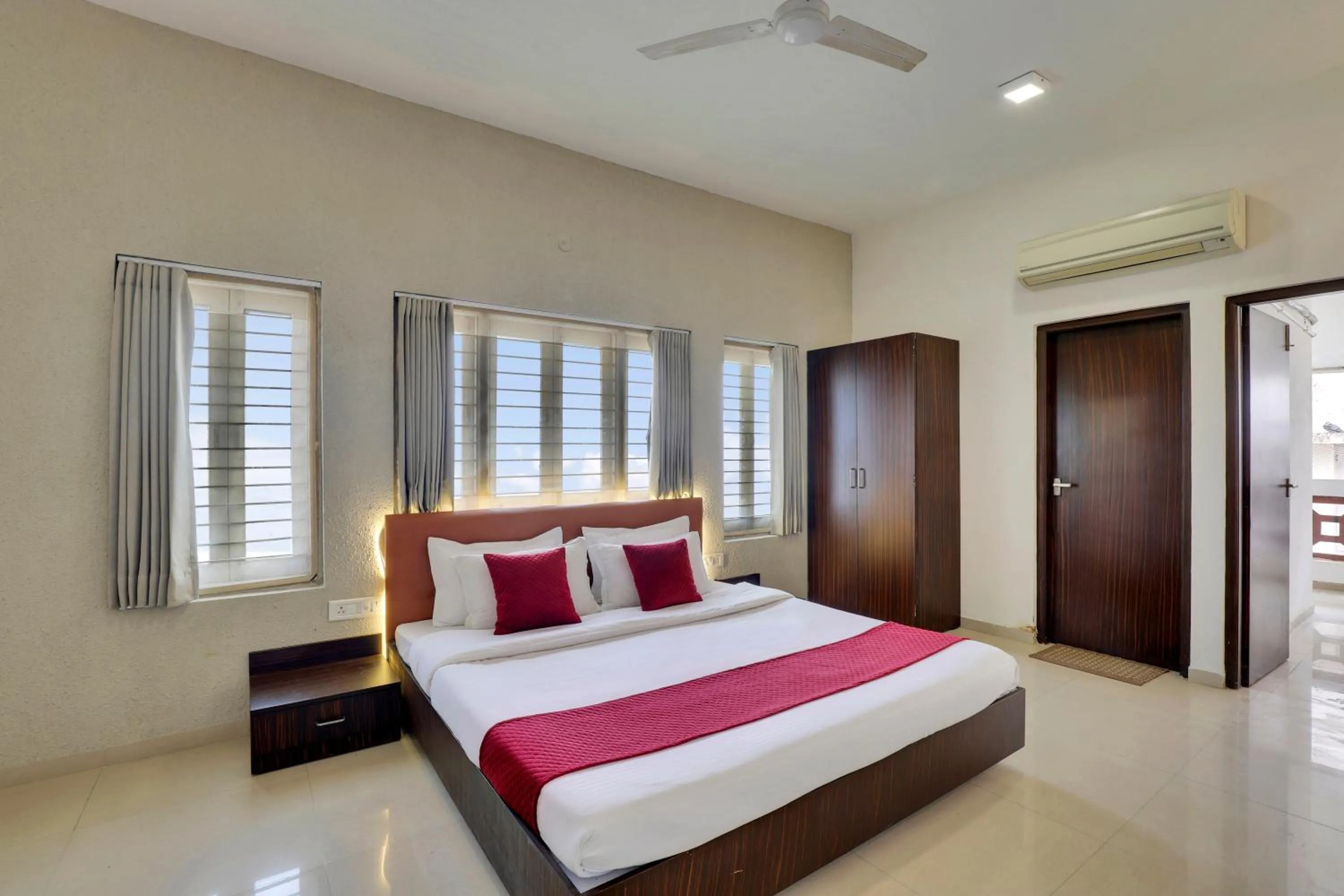 Photo of the whole room, Bed in Goverdhan Greens Resort Dwarka l Hotels In Dwarka