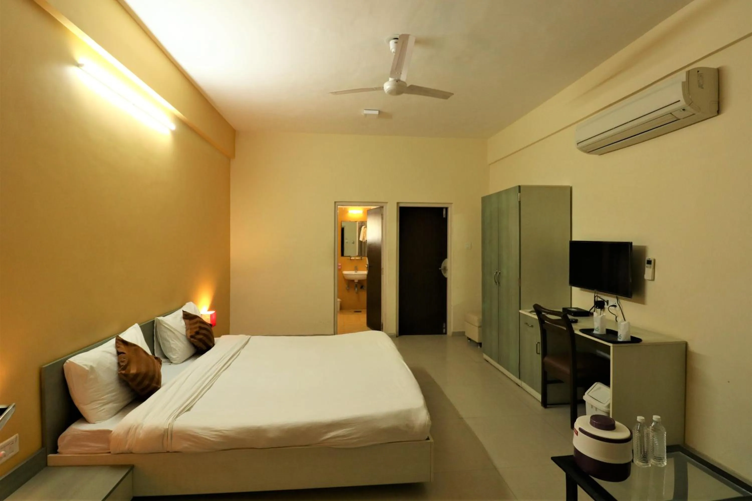 Photo of the whole room, Bed in Goverdhan Greens Resort Dwarka l Hotels In Dwarka