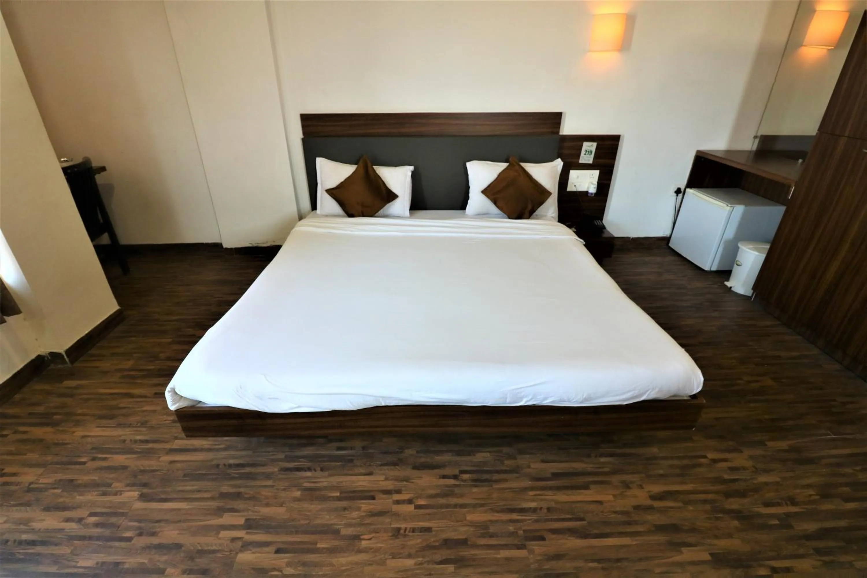 Photo of the whole room, Bed in Goverdhan Greens Resort Dwarka l Hotels In Dwarka
