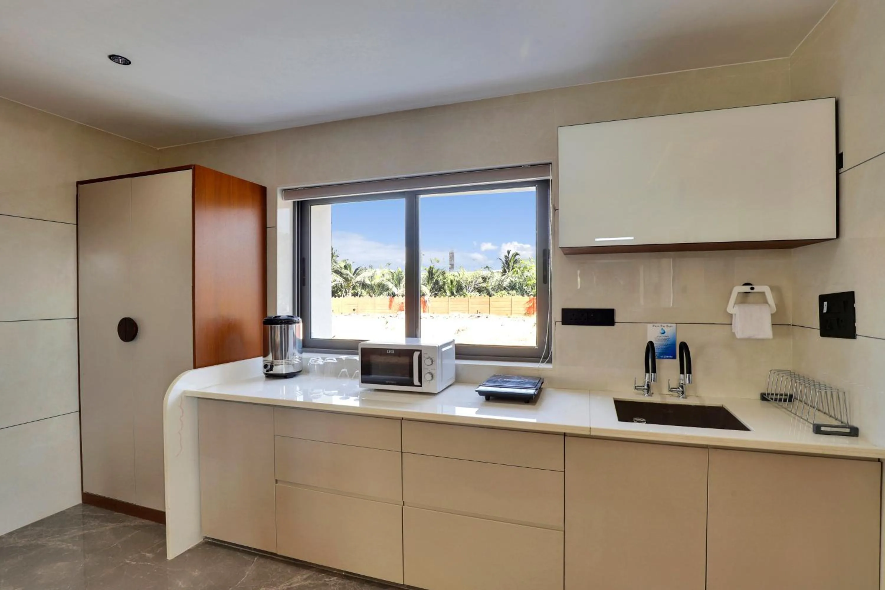 Kitchen or kitchenette in Goverdhan Greens Resort Dwarka l Hotels In Dwarka