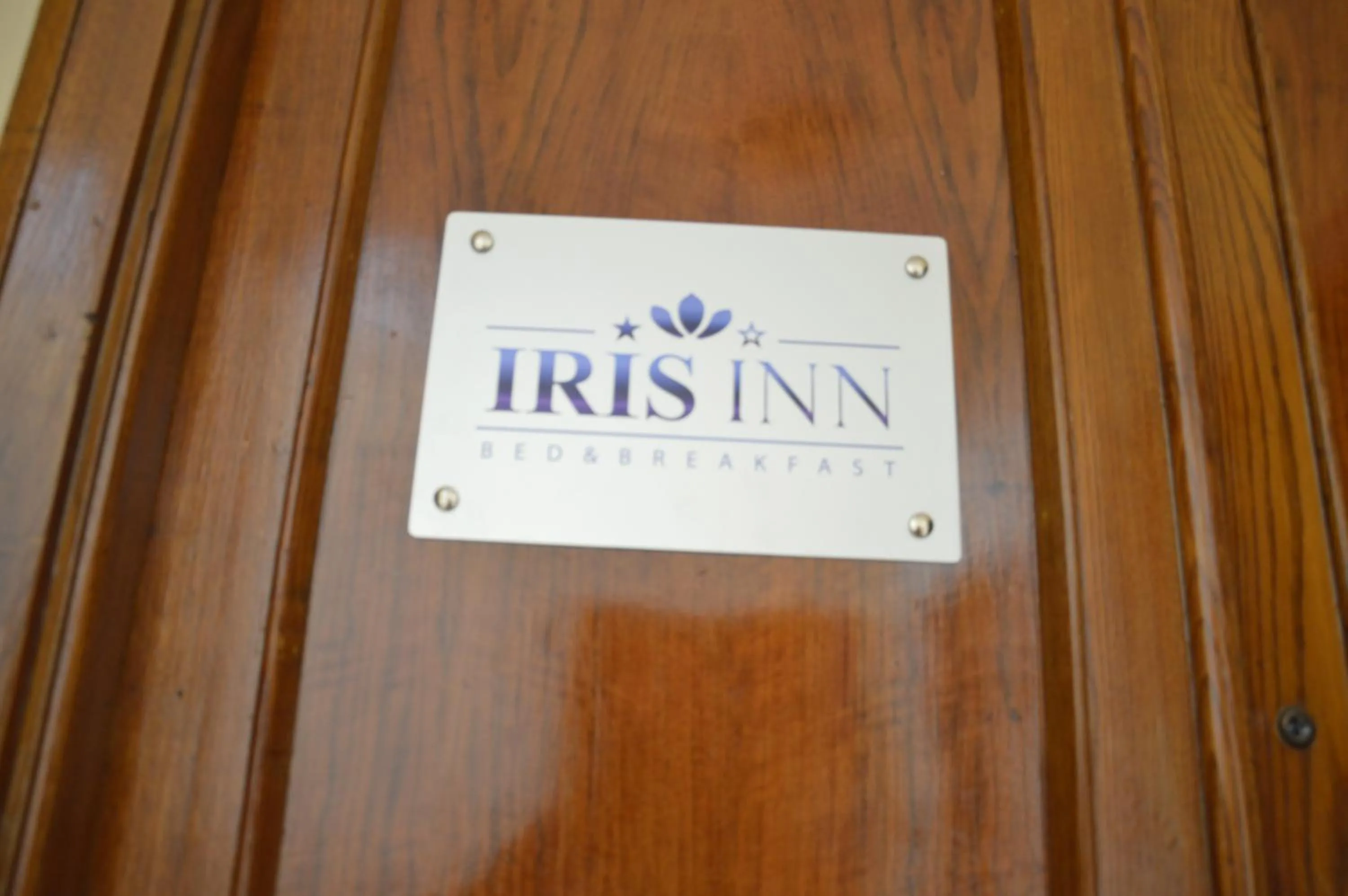 Property logo or sign in Iris Inn