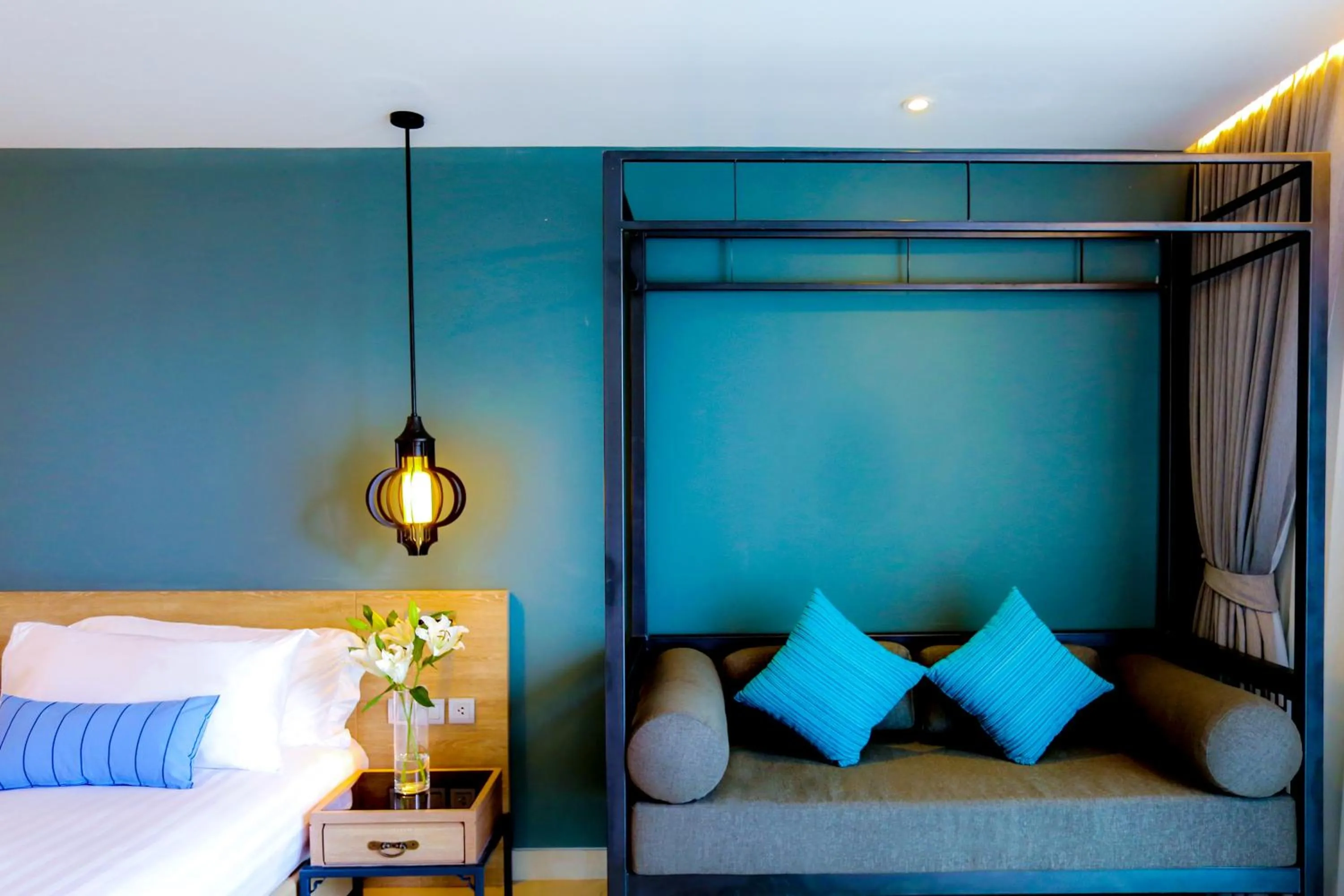 Seating area, Bed in Fusion Suites Phuket Patong