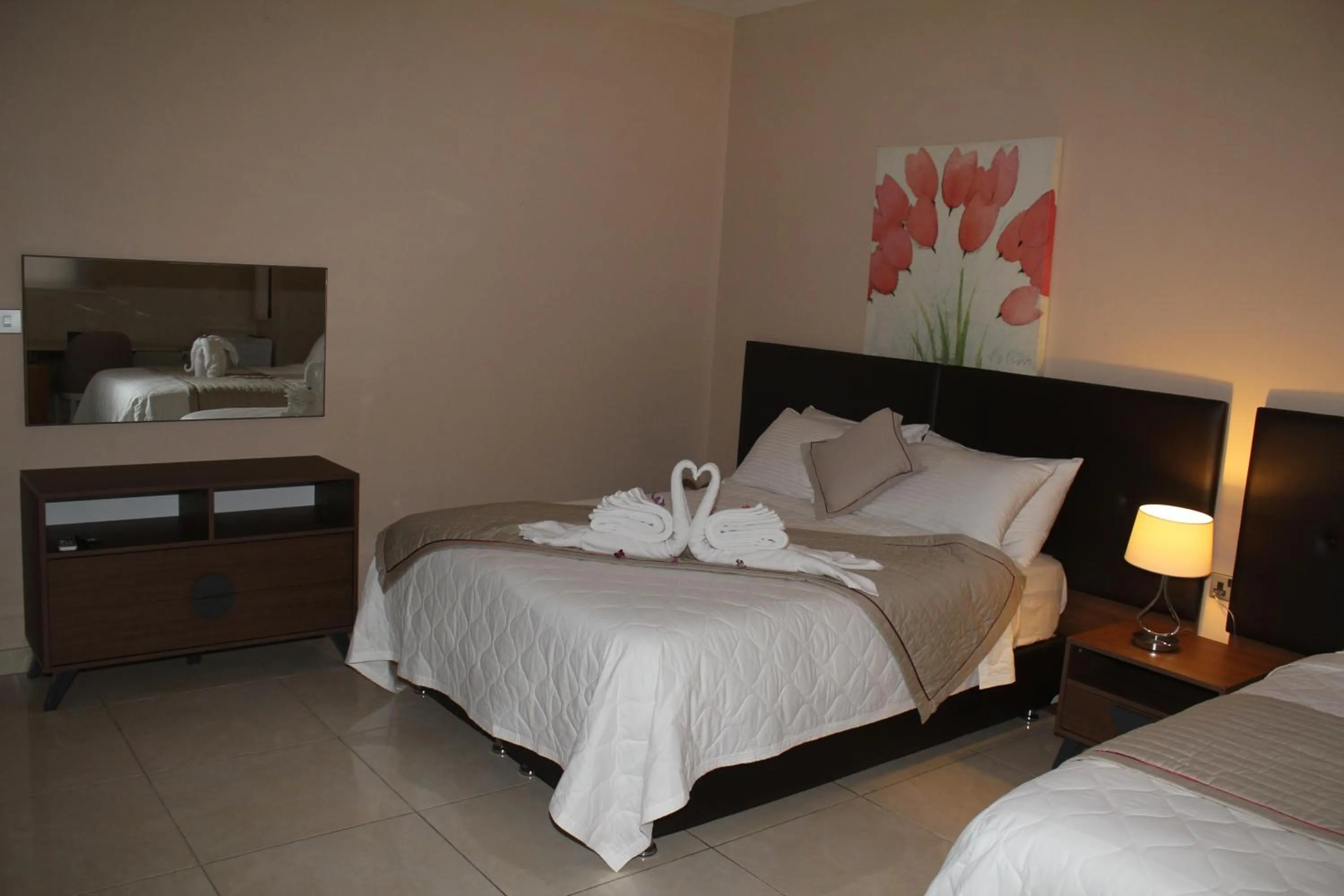 Bed in Murex Plaza Hotel & Suites