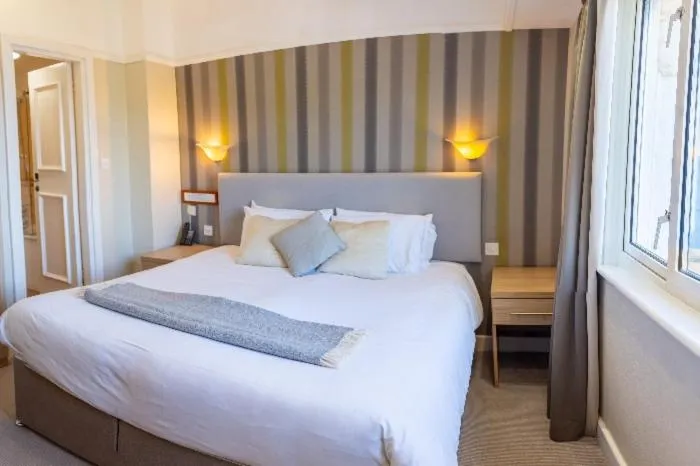 Bed in The Cottage Hotel