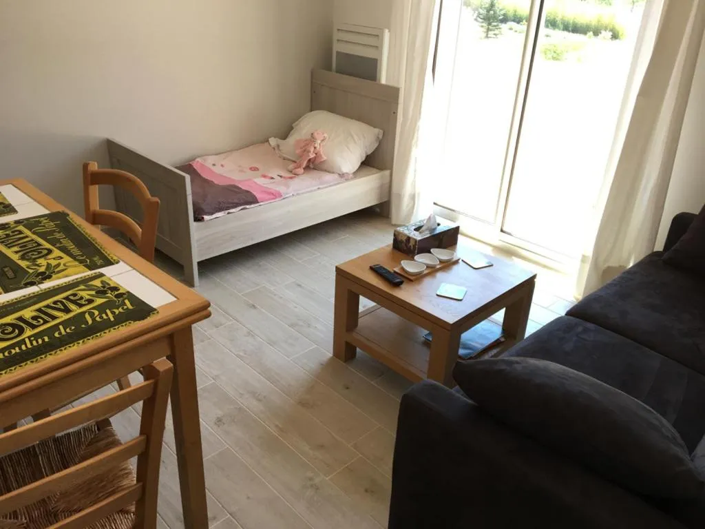 Seating area, Bed in La Villa aux Oliviers