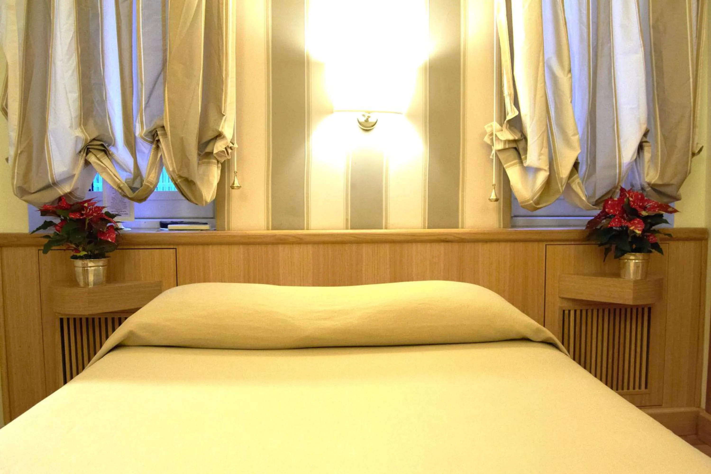 Decorative detail, Bed in Domus Cavour Guest house