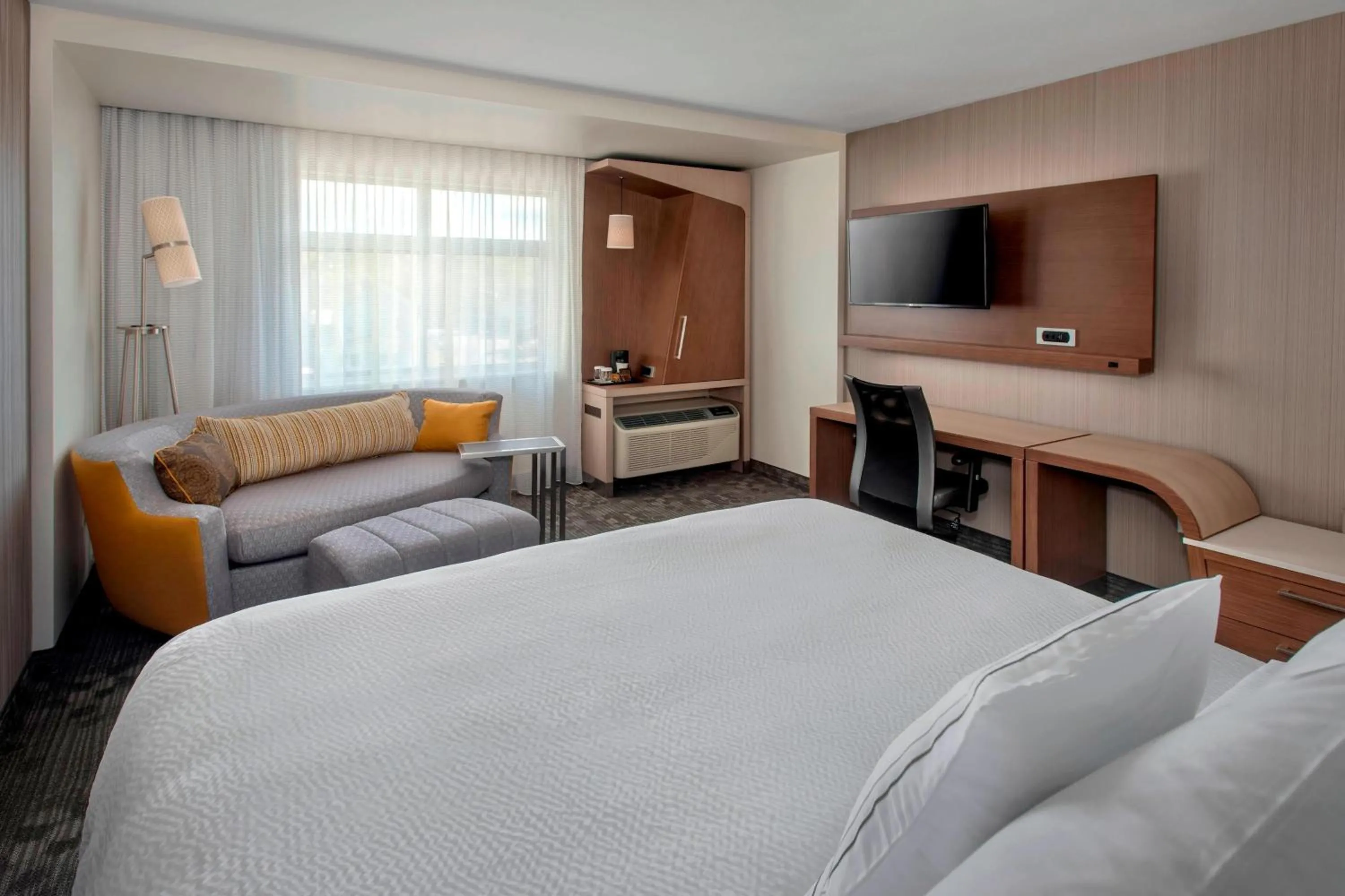 Living room, Bed in Courtyard by Marriott Schenectady at Mohawk Harbor