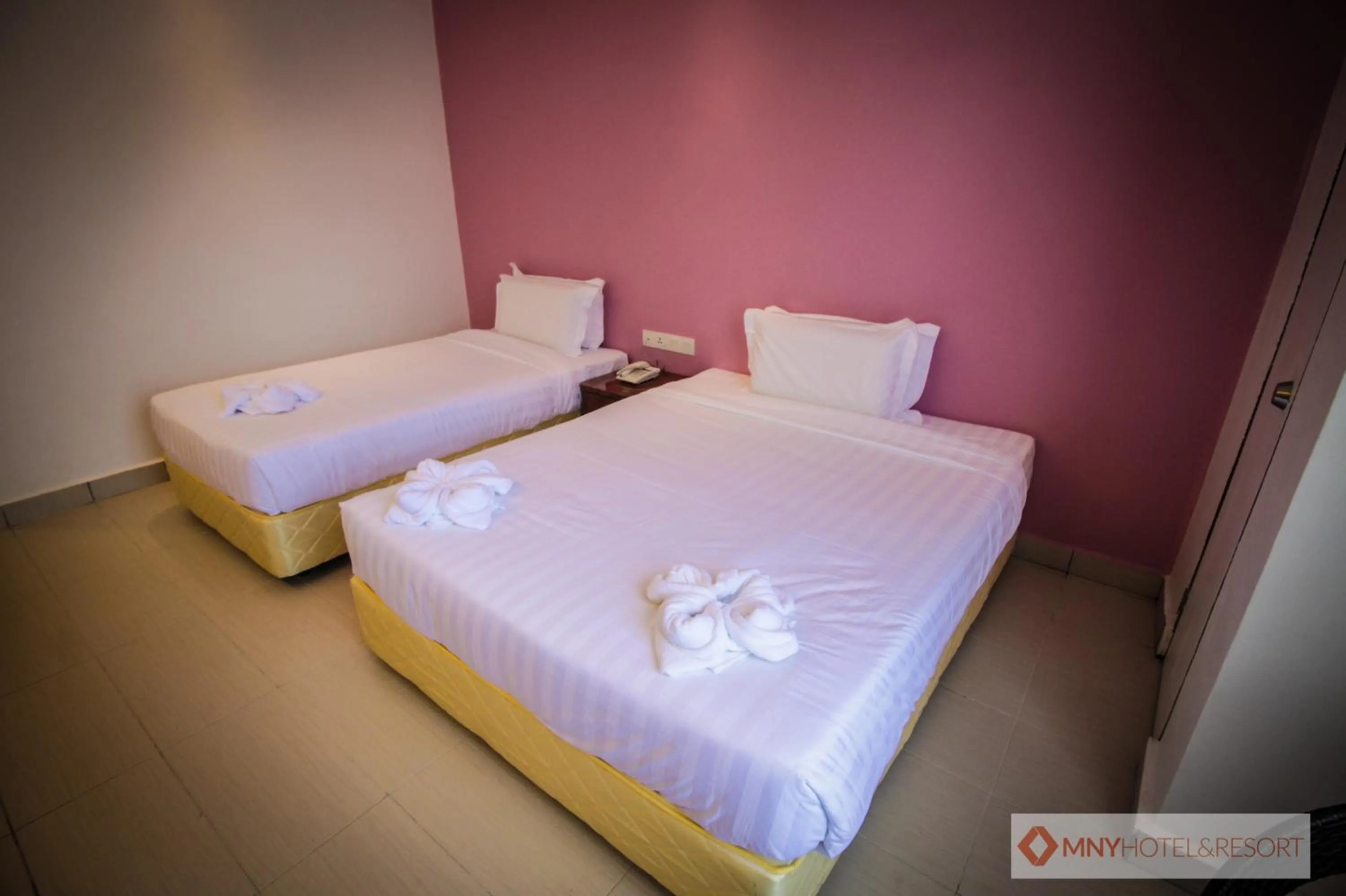 Bed in MNY Hotel & Resort