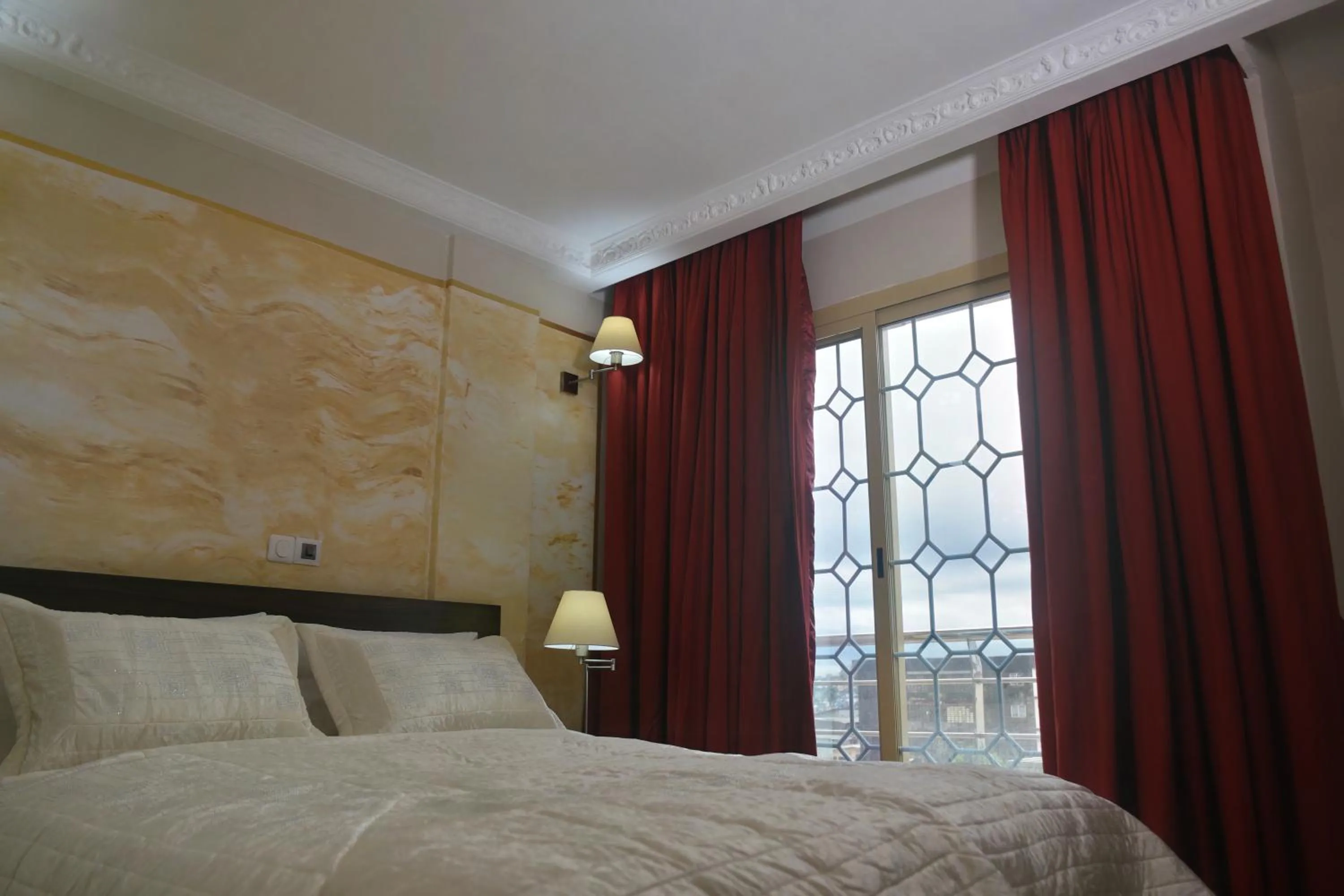 Bed in Noubou International Hotel