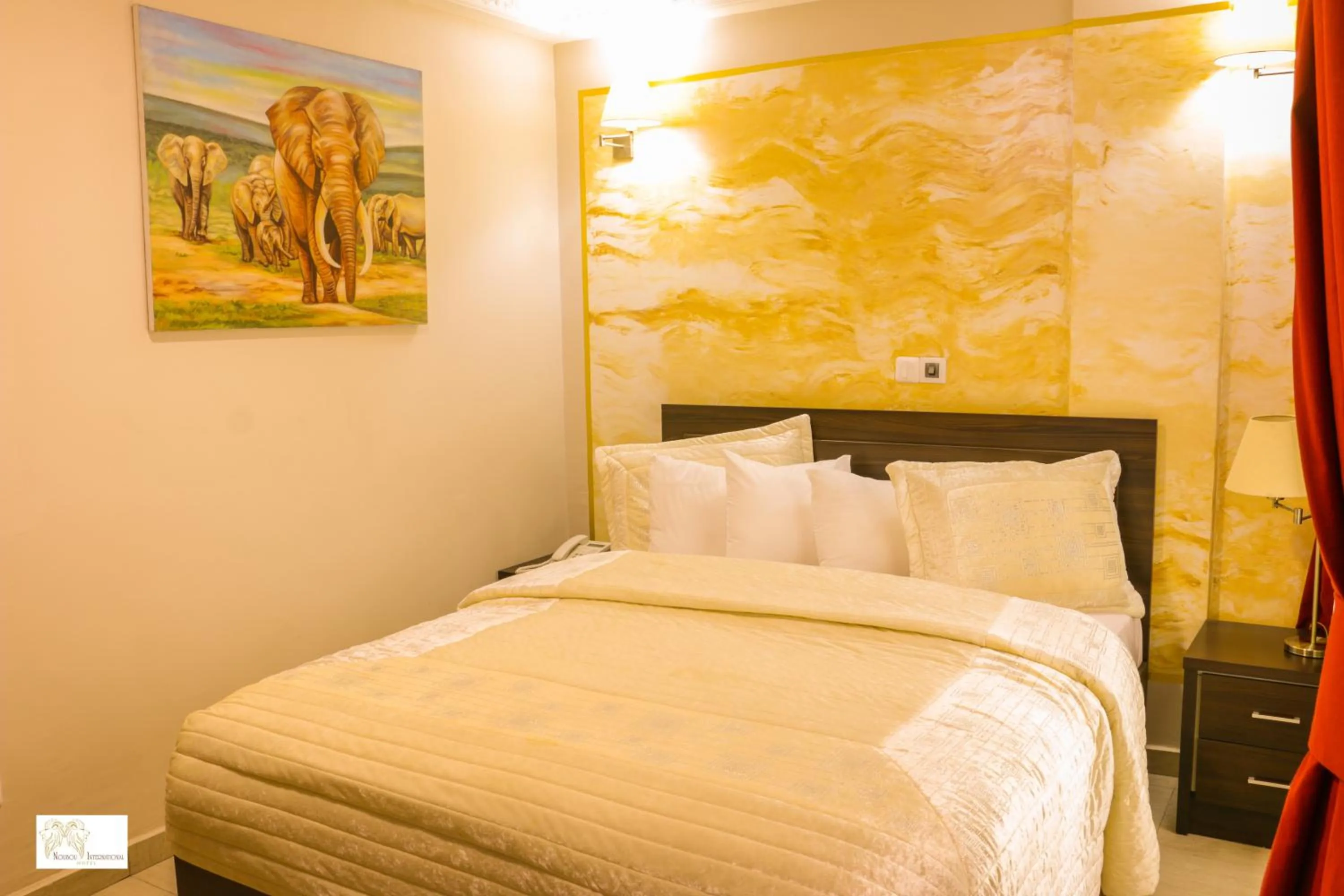 Bedroom in Noubou International Hotel