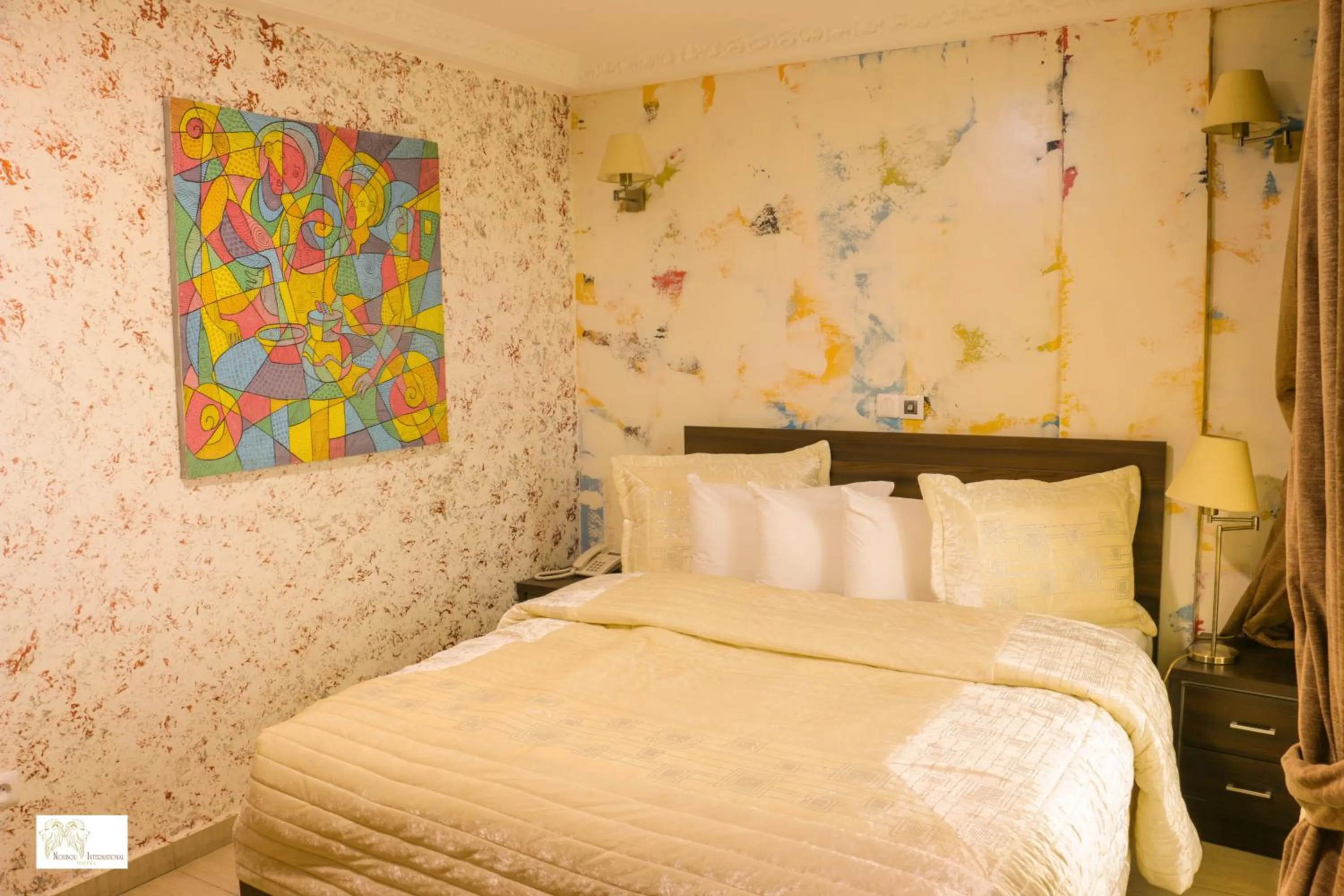 Bedroom in Noubou International Hotel