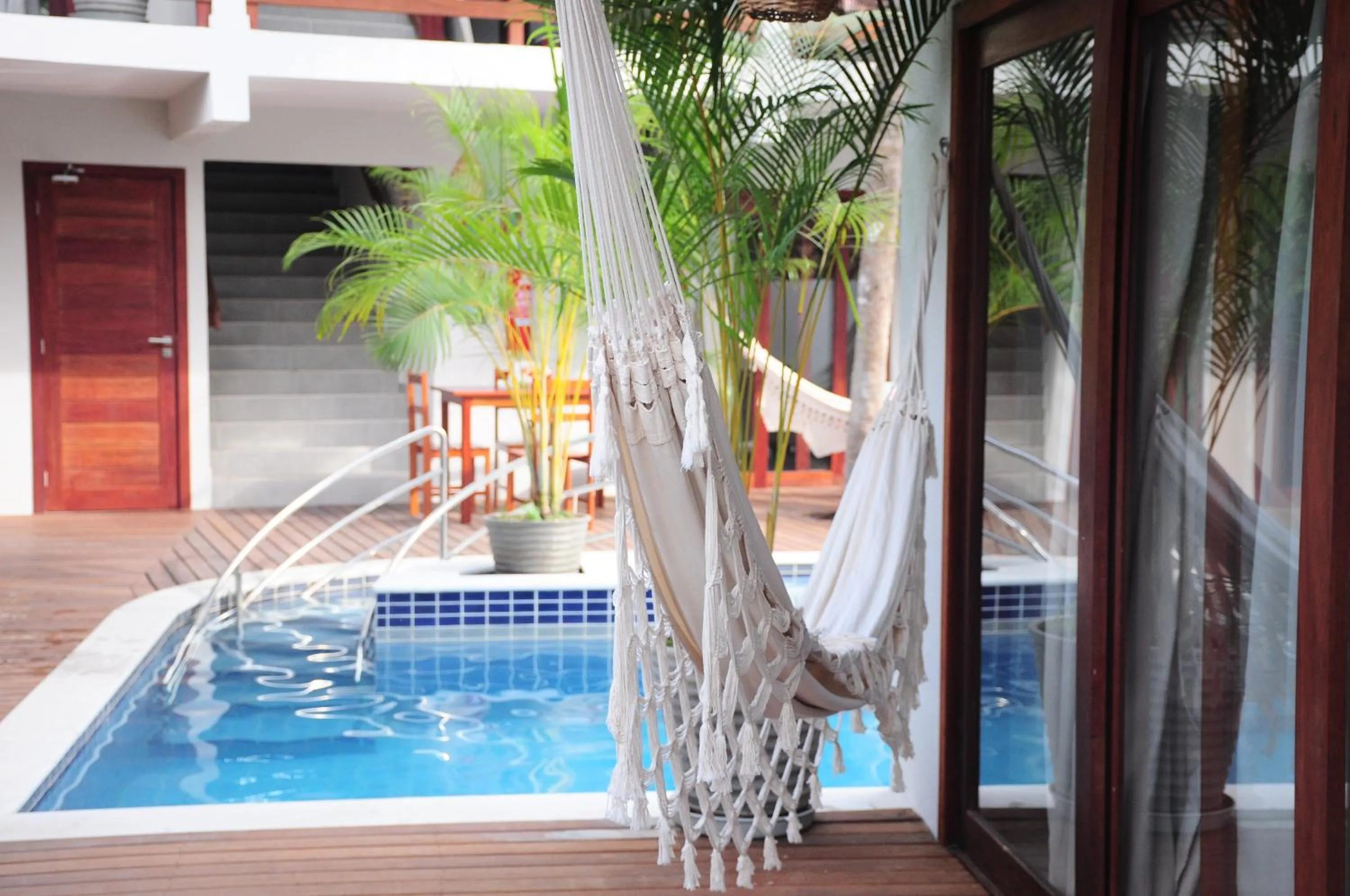 Swimming pool in Pousada Waikiki Boutique