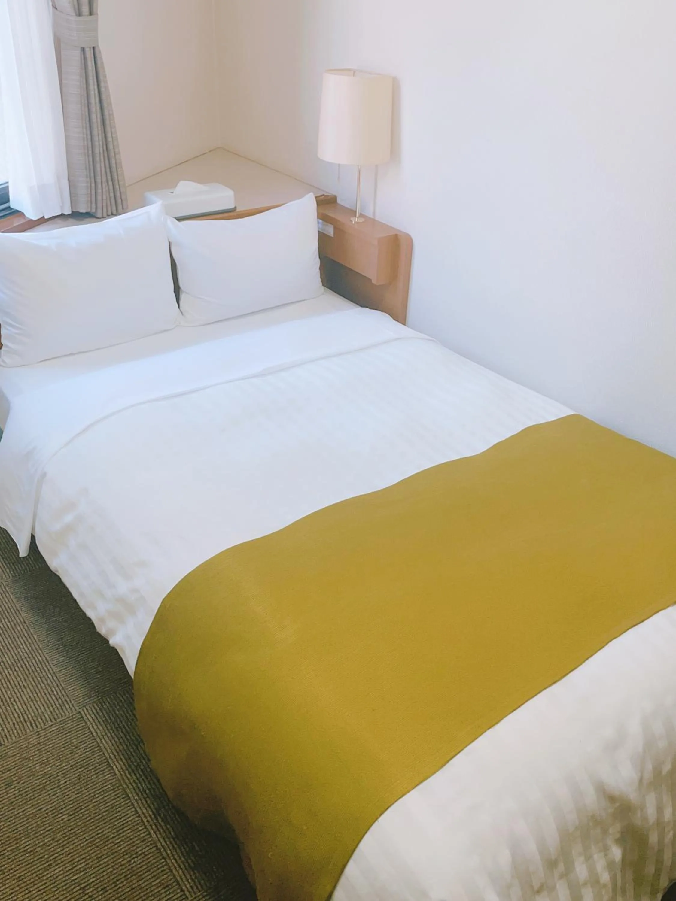 Bed in Fuchu Urban Hotel