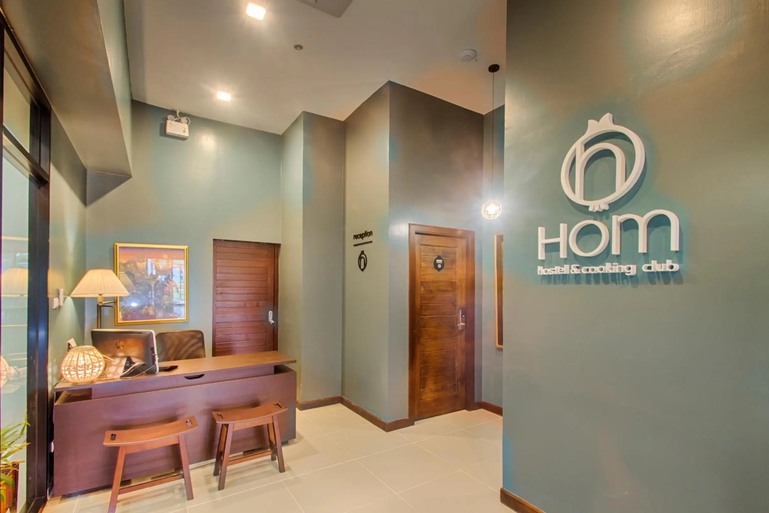 Property logo or sign in Hom Hostel & Cooking Club