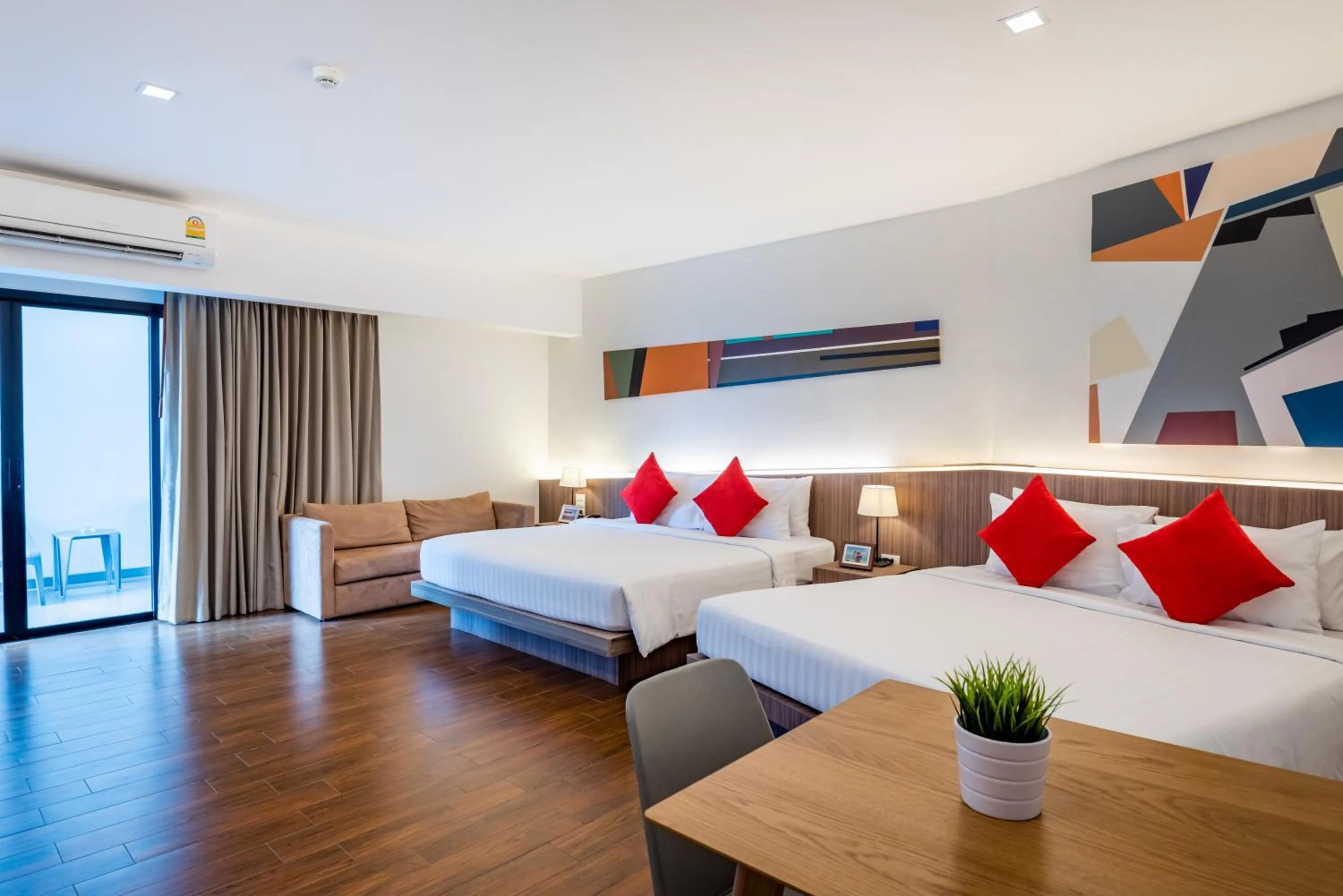 Bed in J Inspired Hotel Pattaya