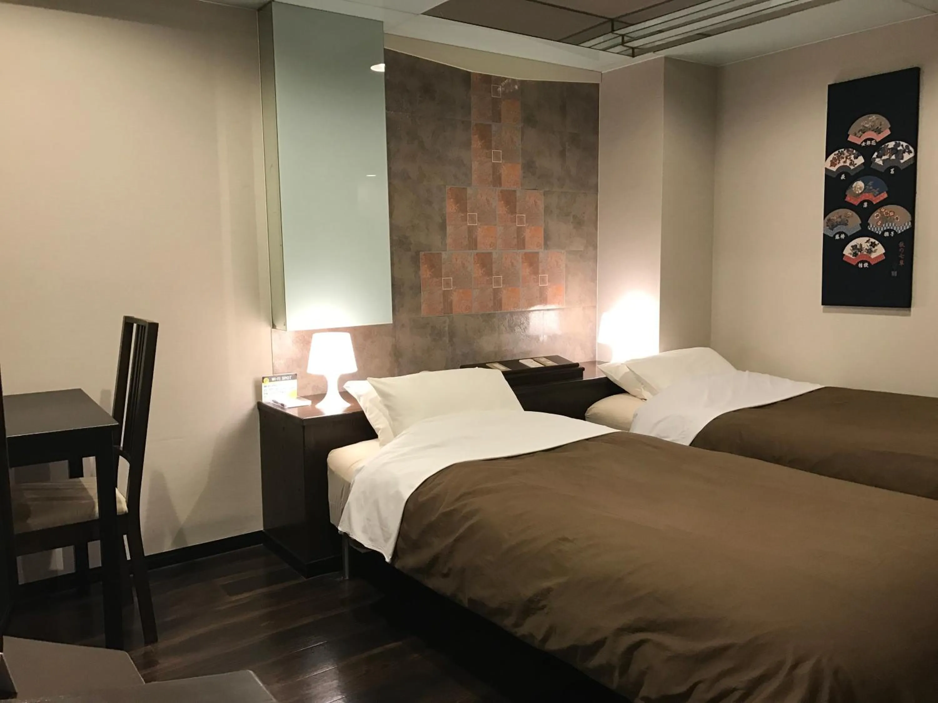 Bed in ビジネスインホテルプラザ21大阪京橋