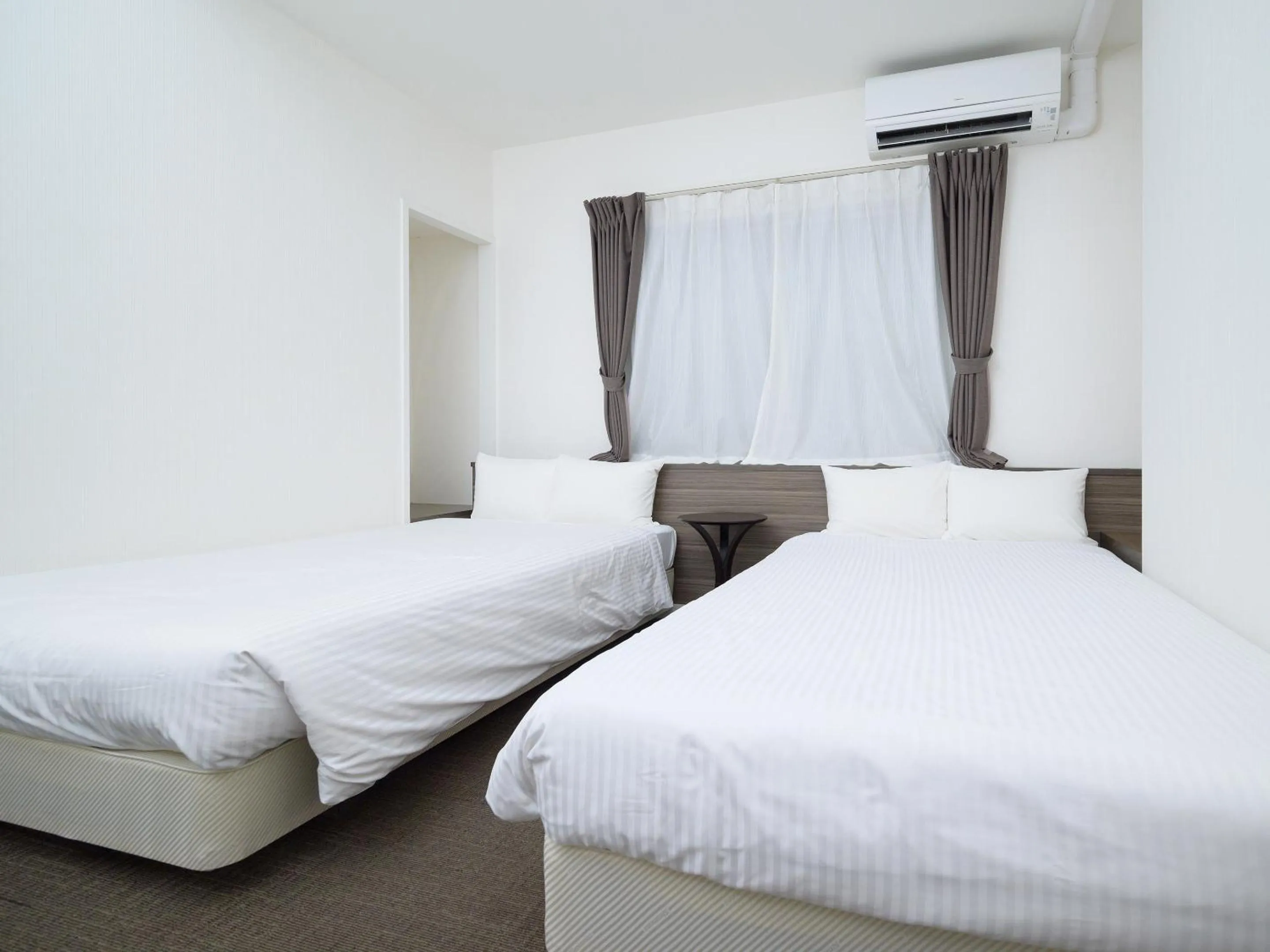 Bed in HOTEL THE CUBE Naha Kokusai Street