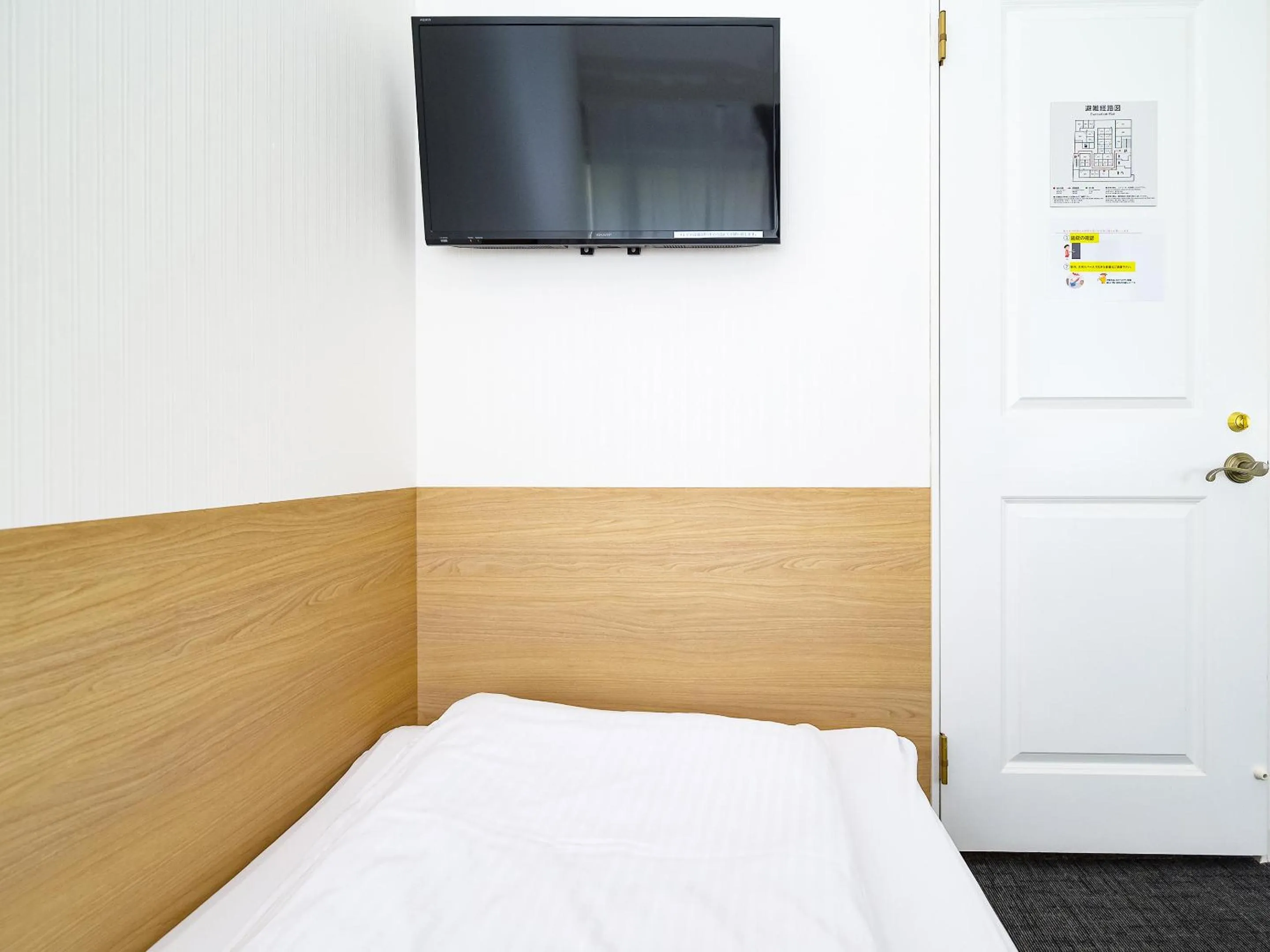 Photo of the whole room, Bed in HOTEL THE CUBE Naha Kokusai Street