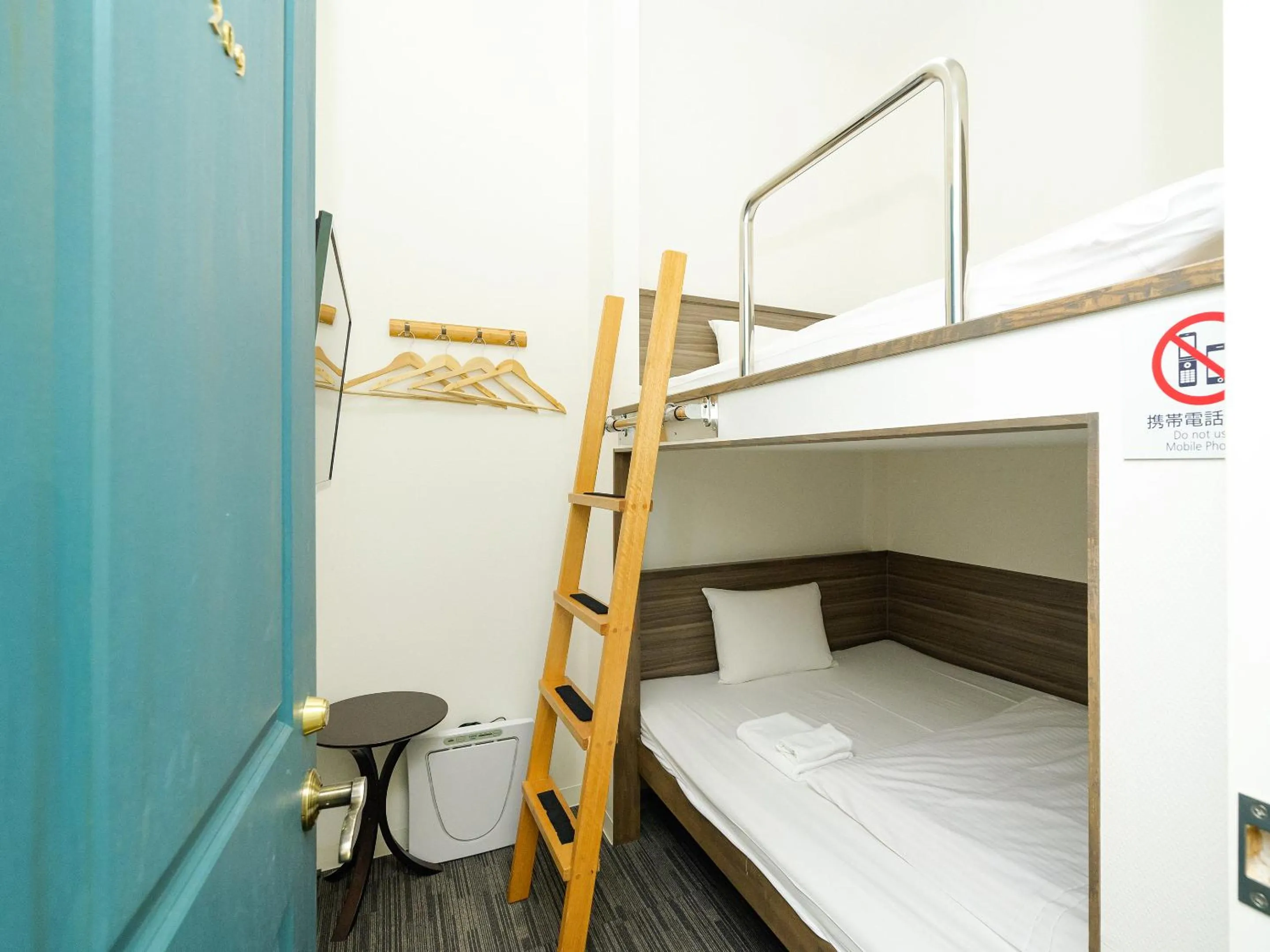 Photo of the whole room, Bed in HOTEL THE CUBE Naha Kokusai Street