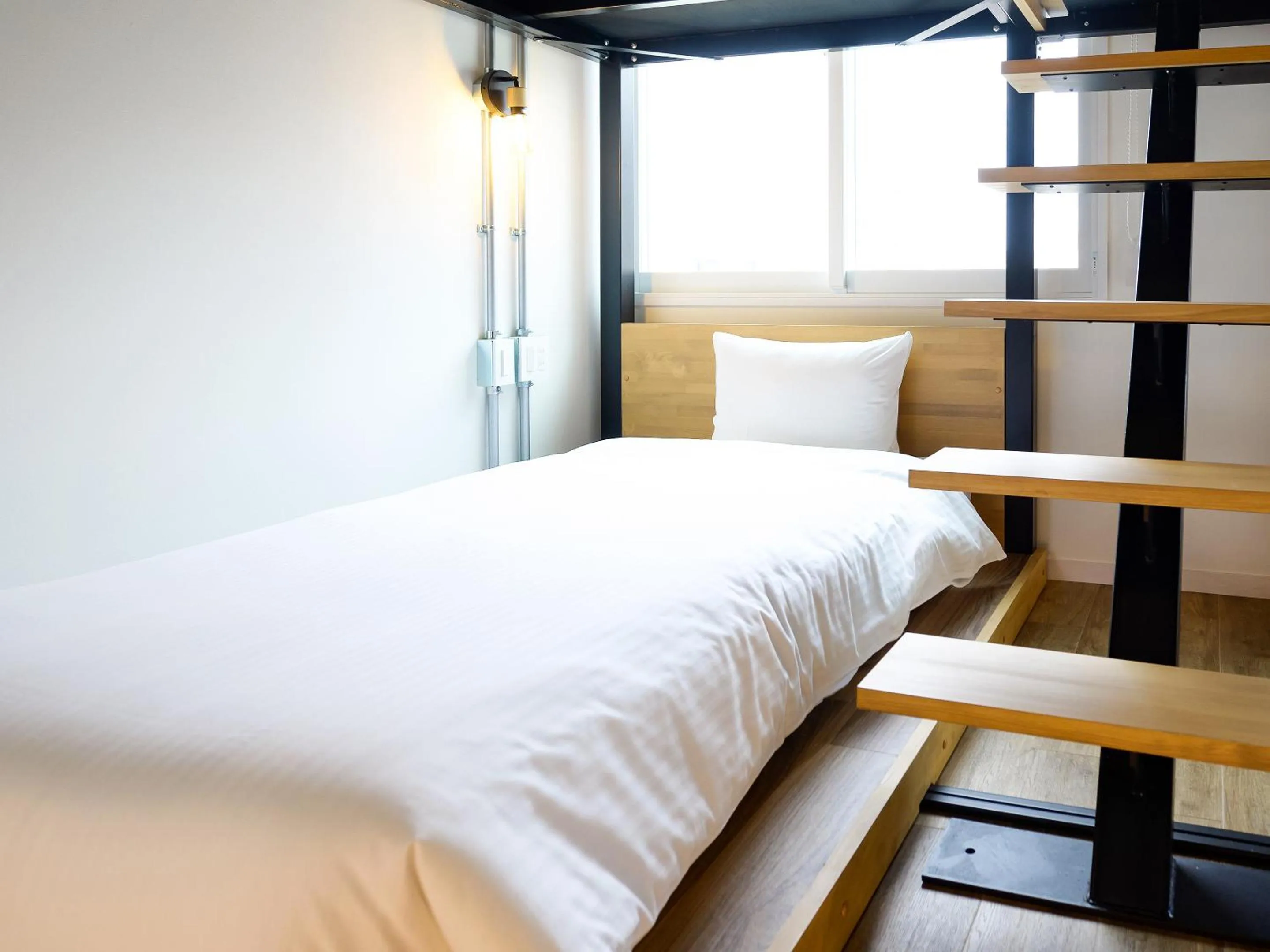 Bed in HOTEL THE CUBE Naha Kokusai Street