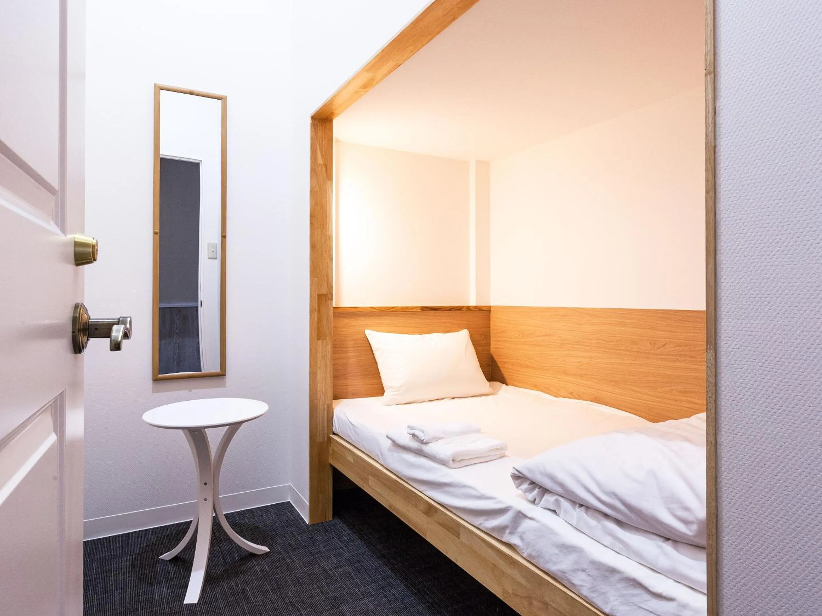 Photo of the whole room, Bed in HOTEL THE CUBE Naha Kokusai Street