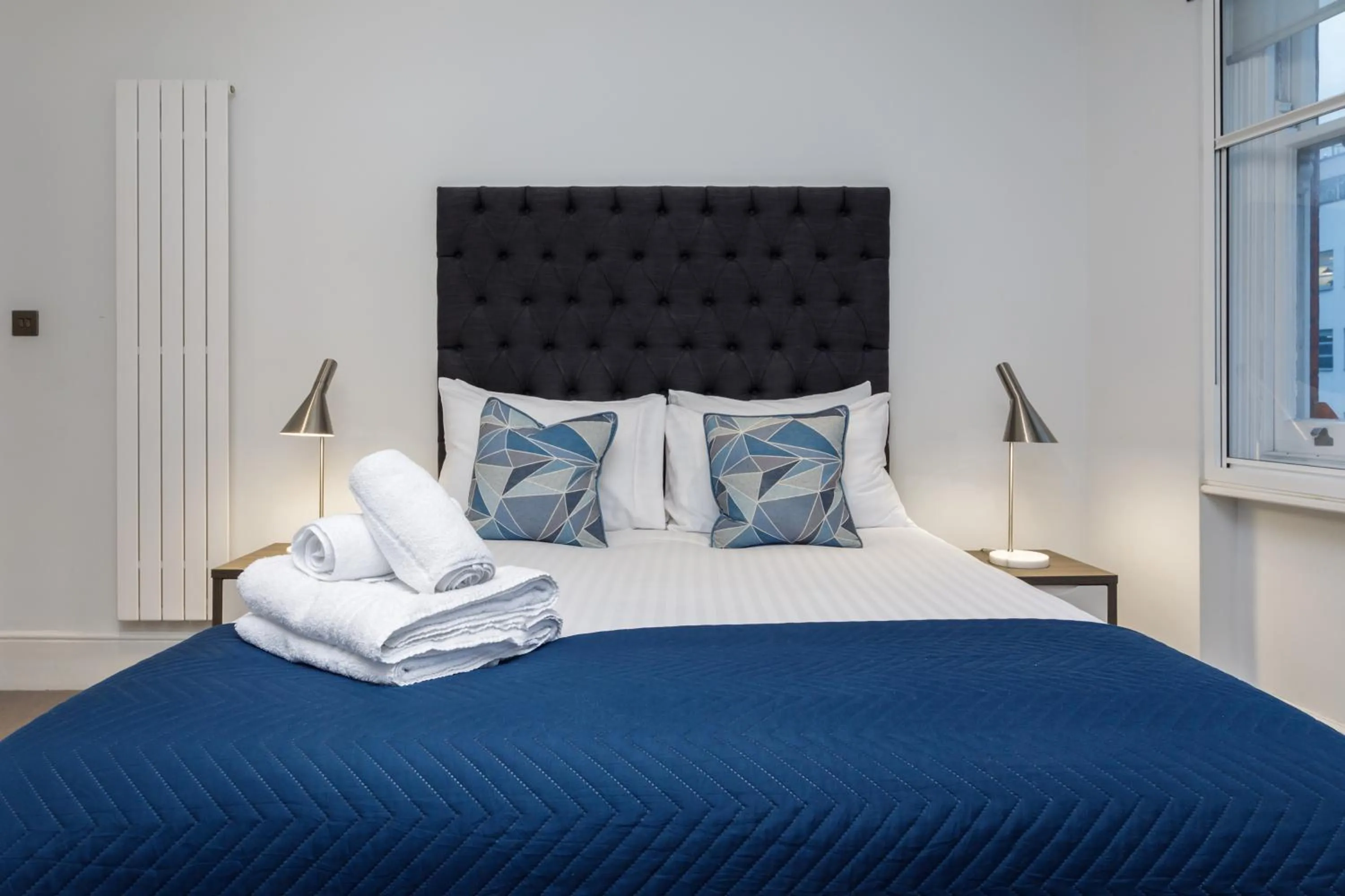 Bed in Garrick Mansions by Aeria Apartments