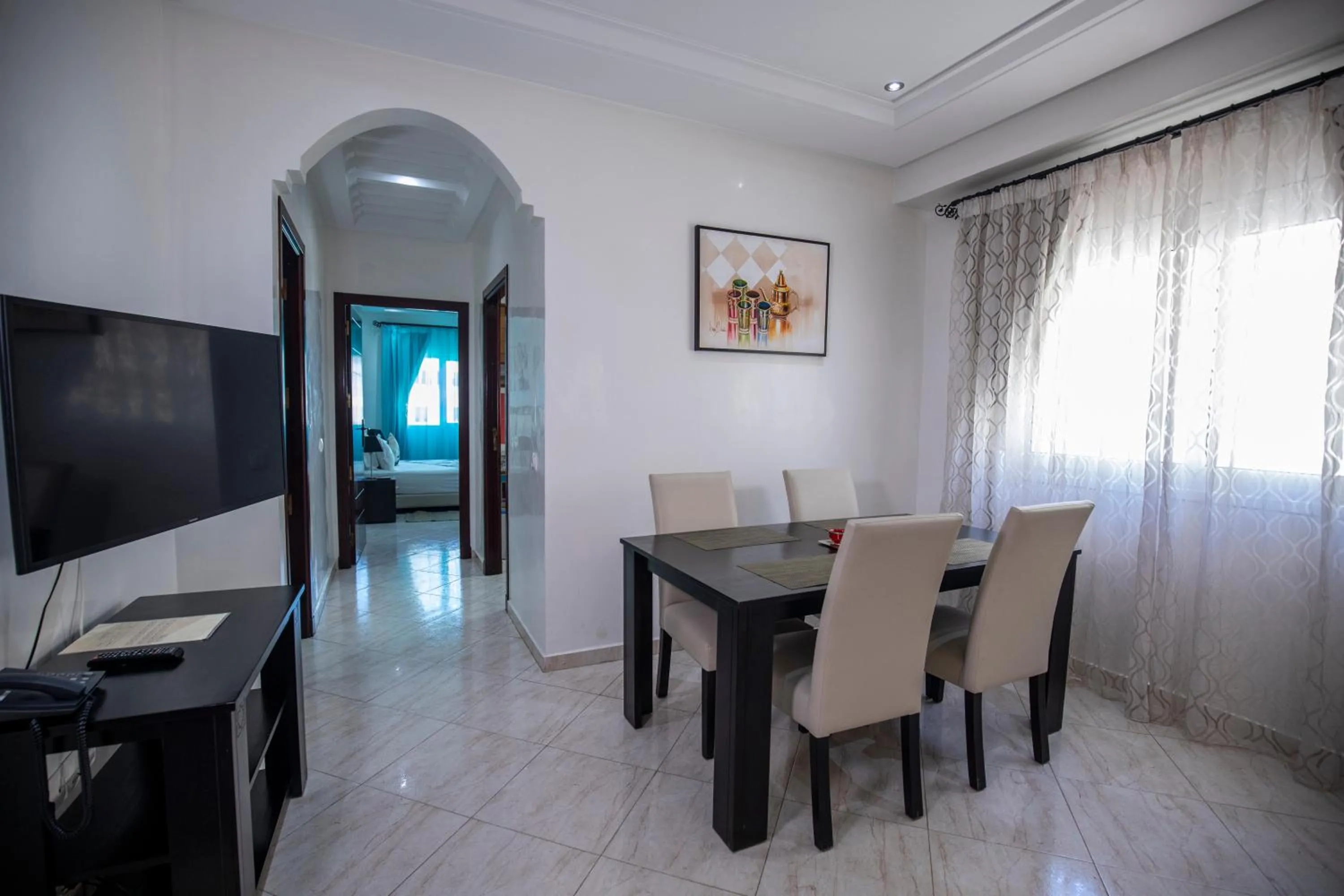 Communal lounge/ TV room in Appart Hotel Rania