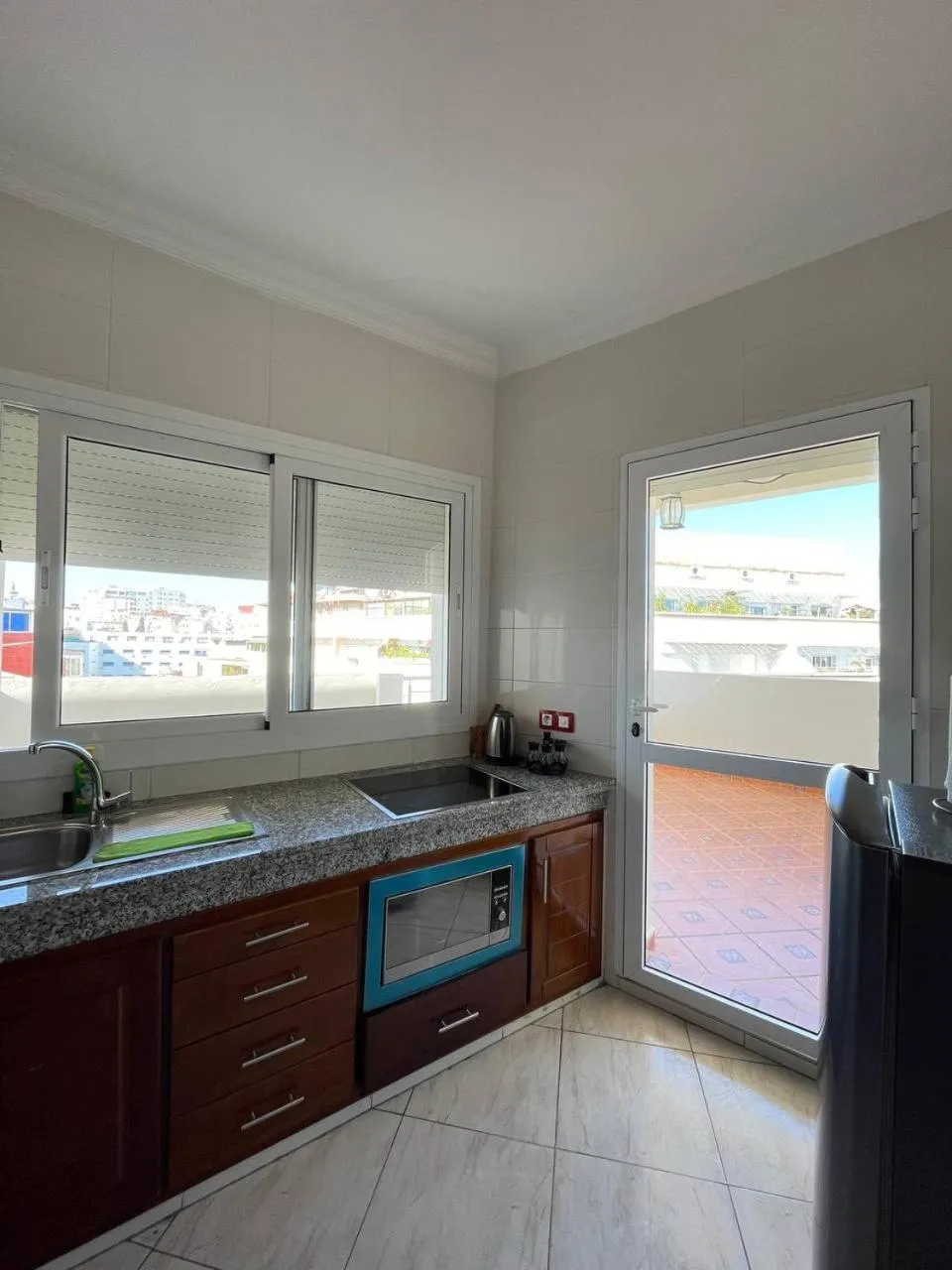 Kitchen or kitchenette in Appart Hotel Rania