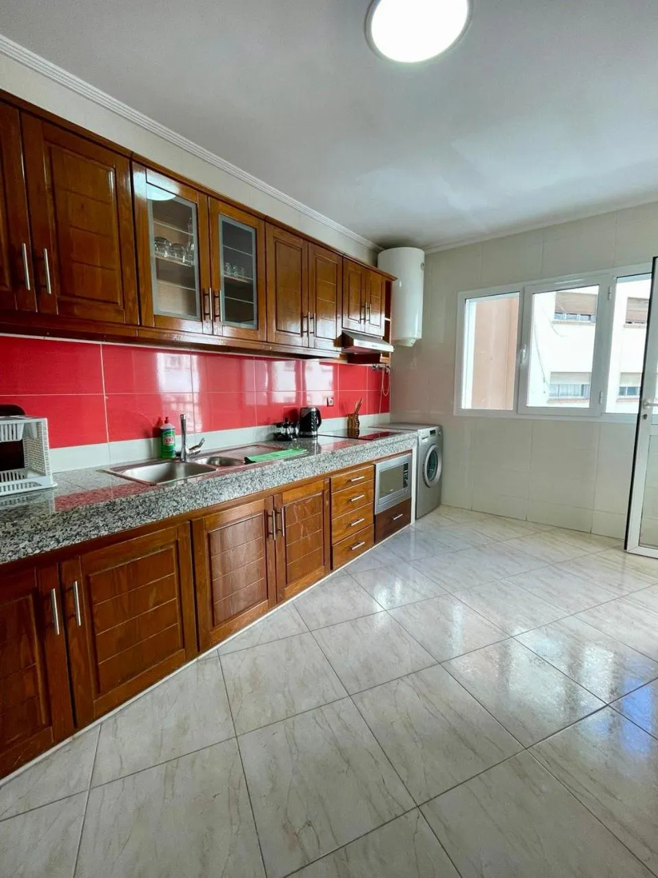 Kitchen or kitchenette in Appart Hotel Rania