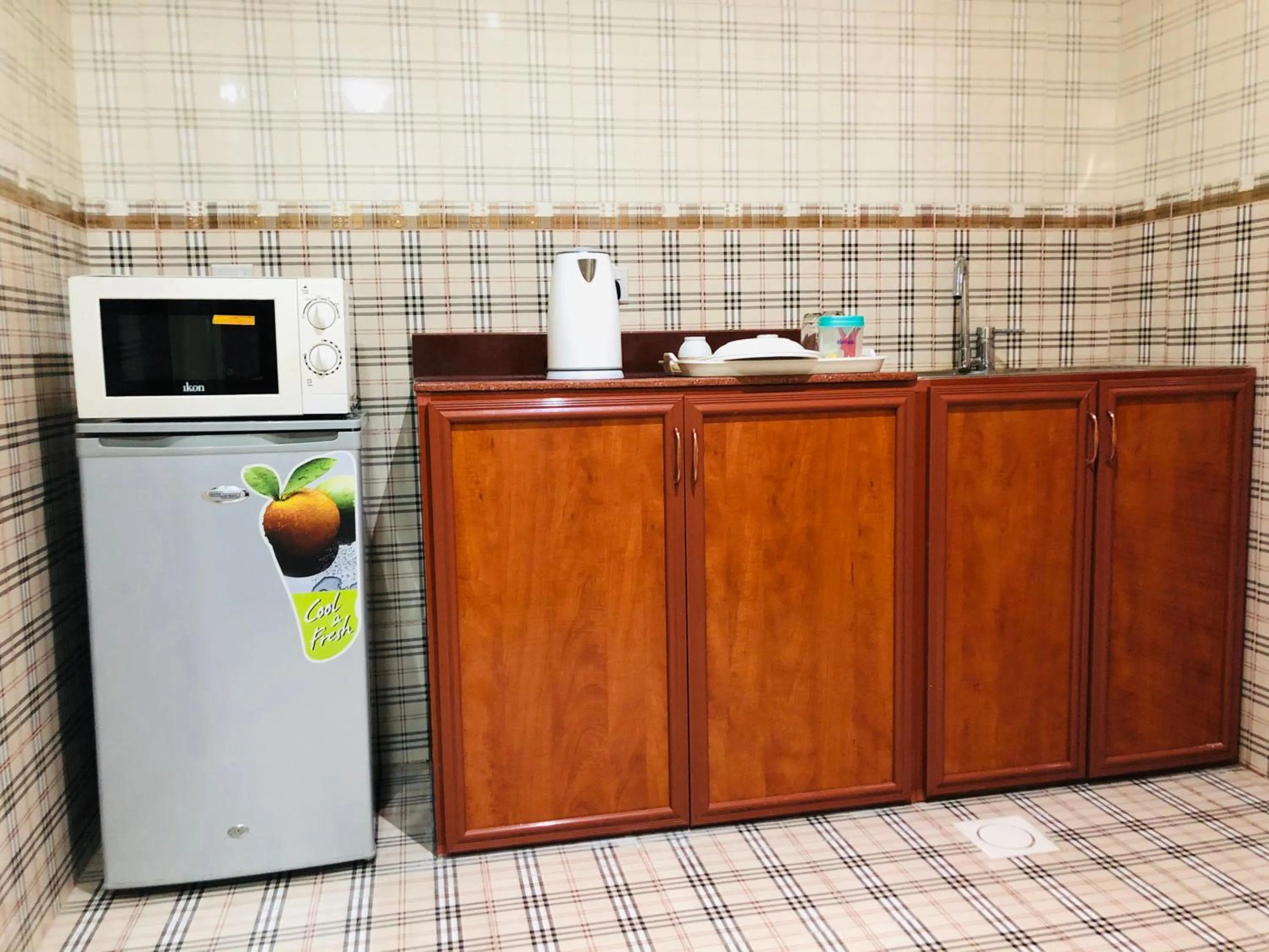 Kitchen or kitchenette in Al Nakheel Hotel Apartments