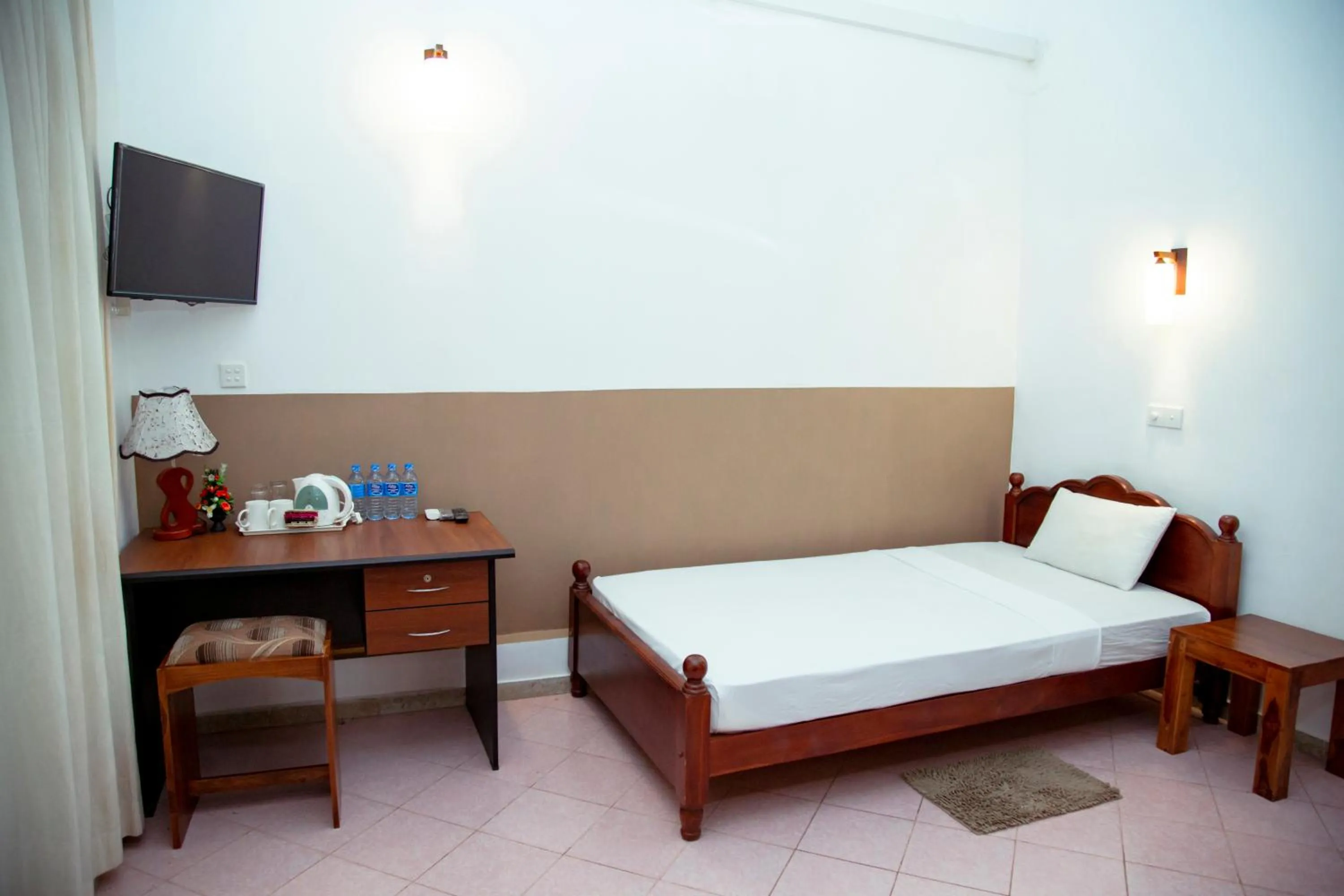 Bed in Prince Beach Hotel Bentota