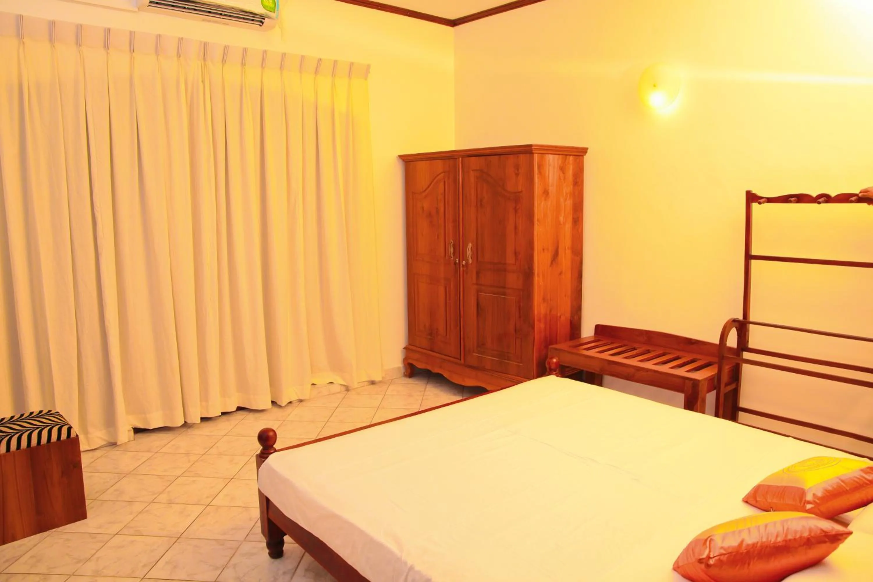 Living room, Bed in Prince Beach Hotel Bentota