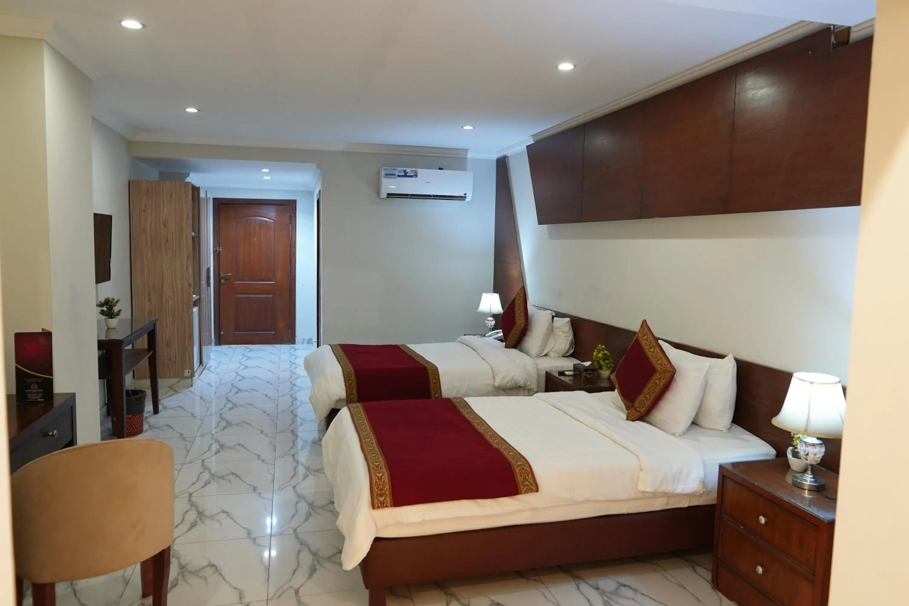 Bed in Grand Millennium Hotel