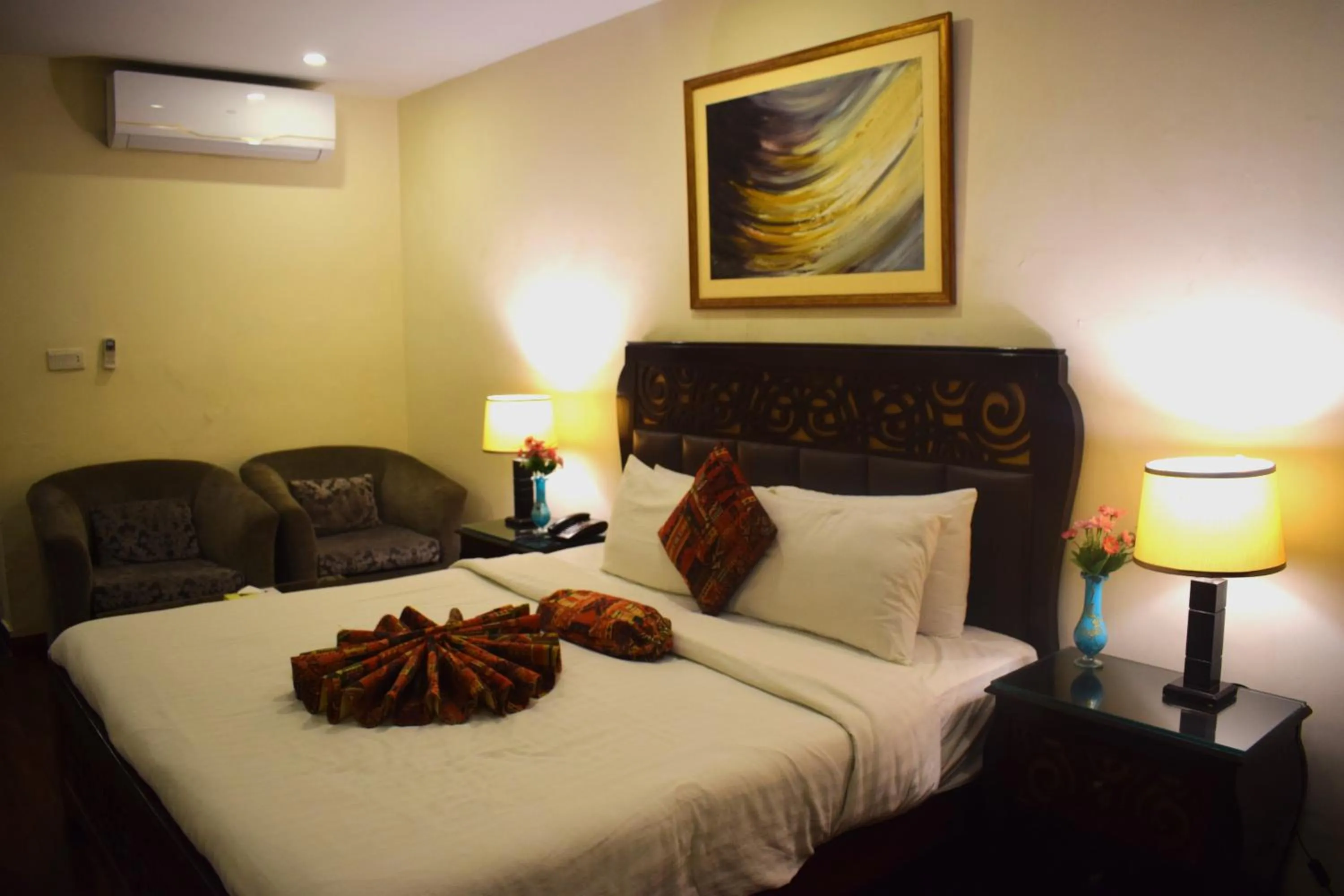 Bed in Grand Millennium Hotel