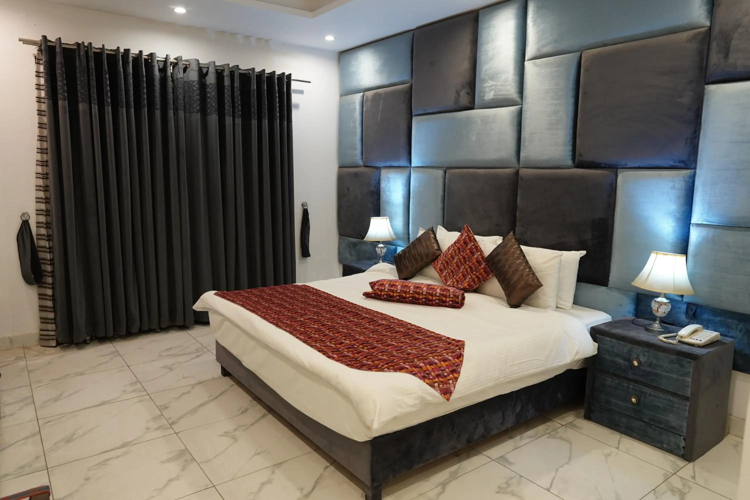 Bed in Grand Millennium Hotel