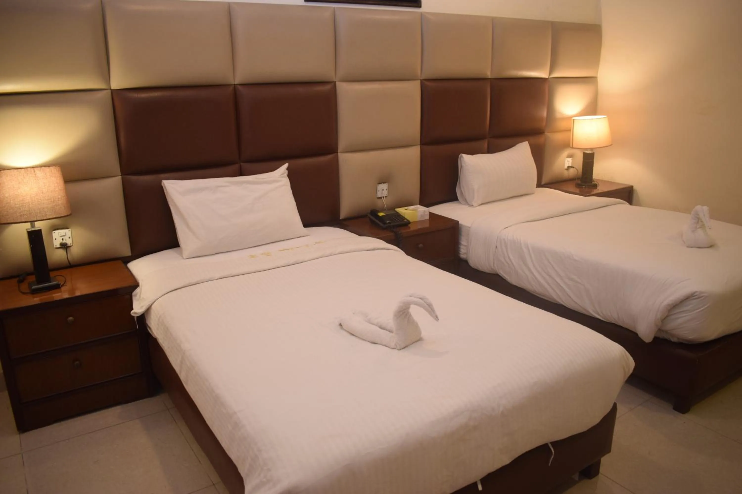 Bed in Grand Millennium Hotel