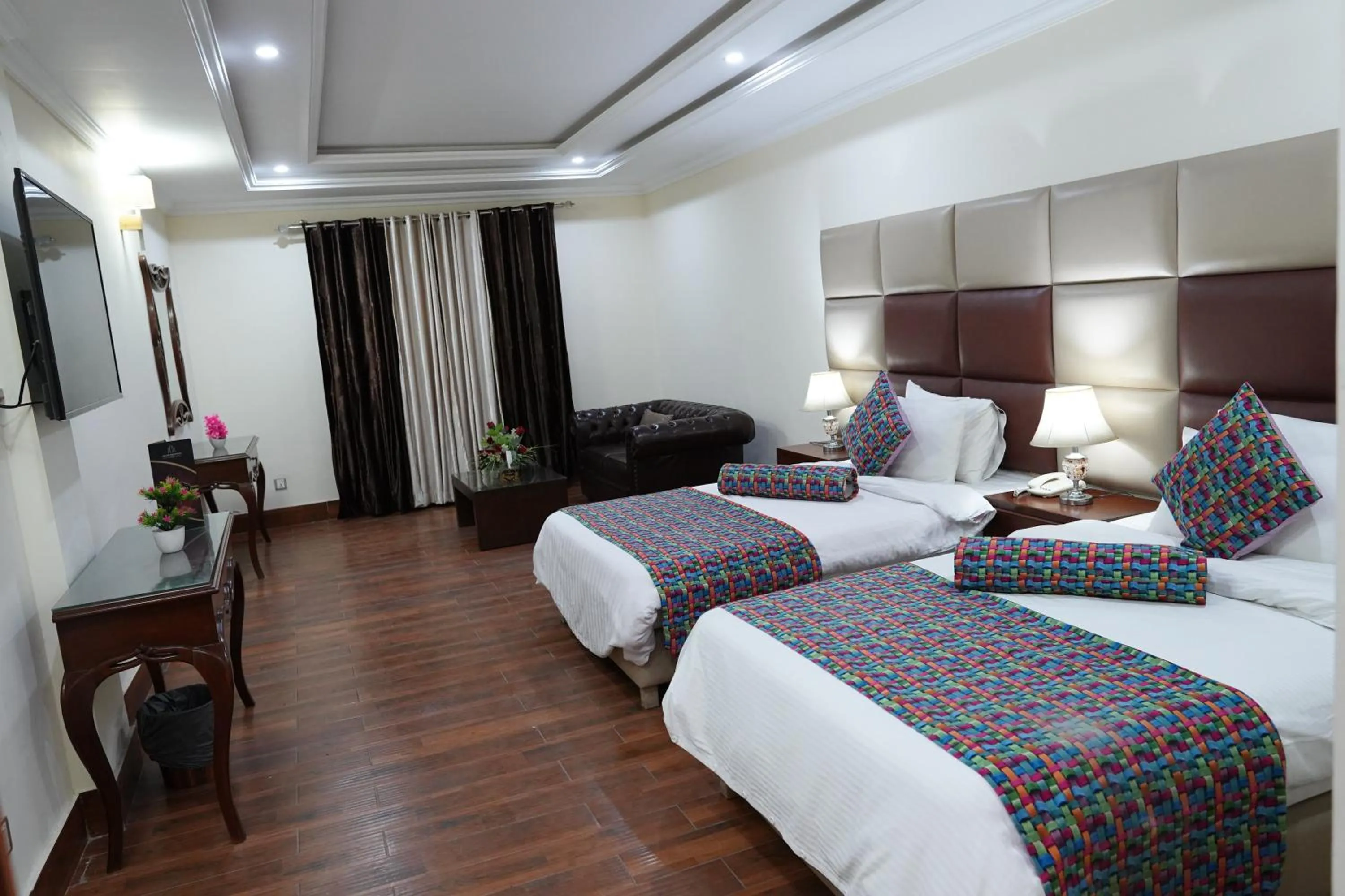 Bed in Grand Millennium Hotel