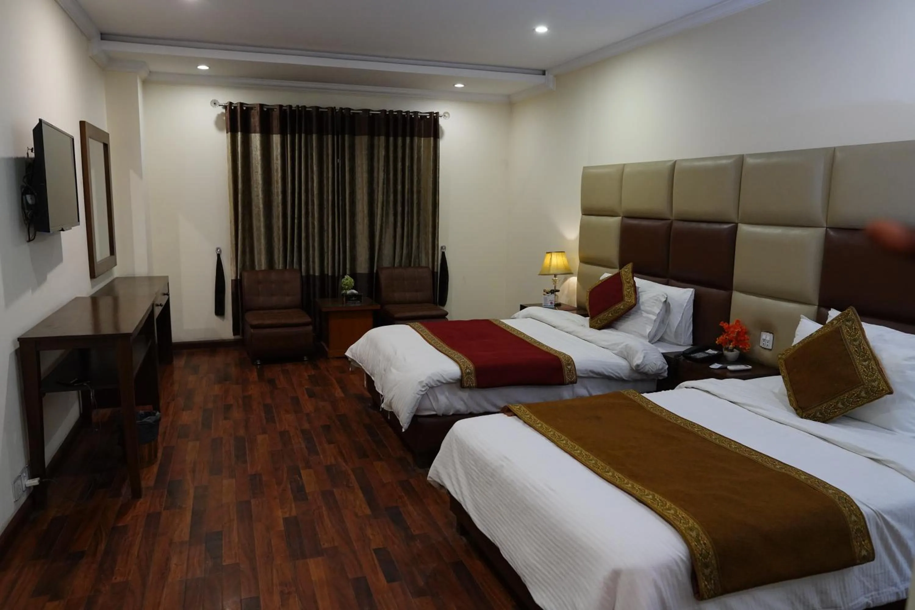 Bed in Grand Millennium Hotel