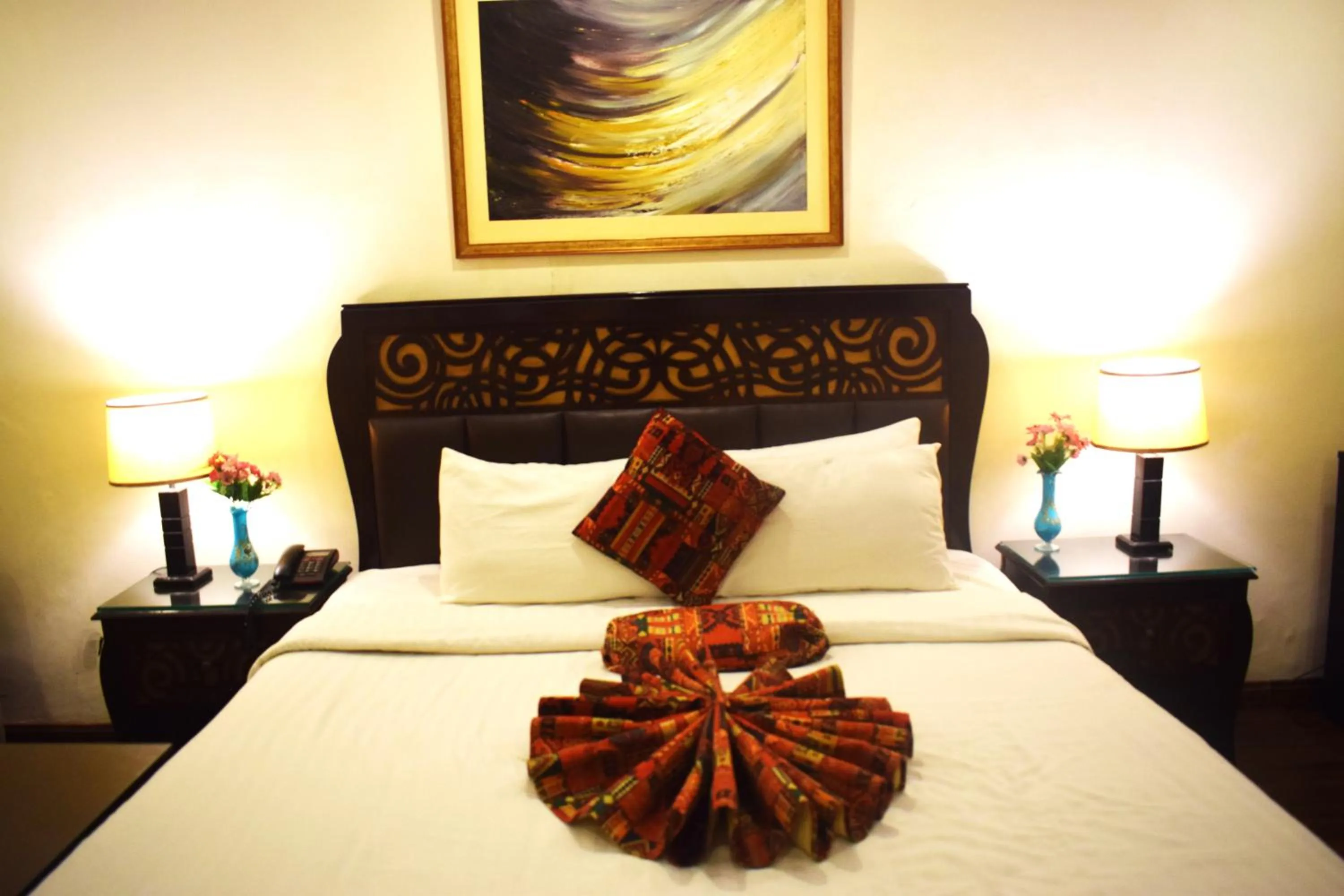 Bed in Grand Millennium Hotel