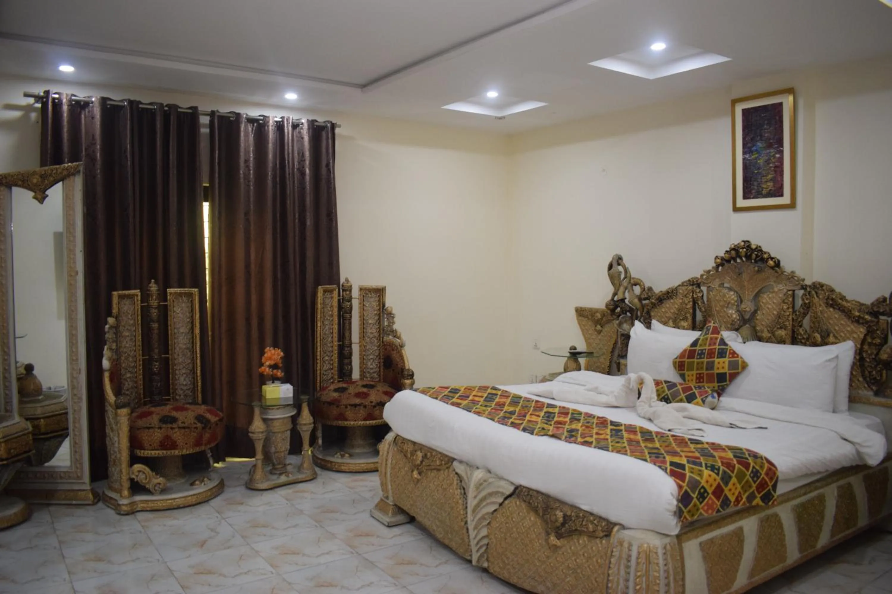 Bed in Grand Millennium Hotel